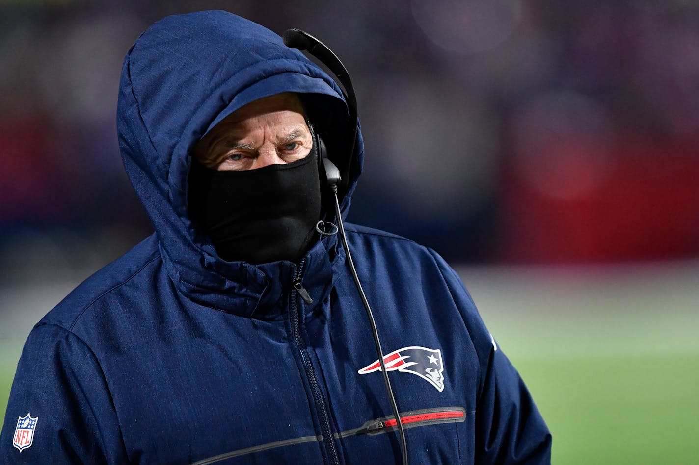 New England Patriots head coach Bill Belichick walks the sidelines during the second half of an NFL wild-card playoff football game against the Buffalo Bills, Saturday, Jan. 15, 2022, in Orchard Park, N.Y. (AP Photo/Adrian Kraus)