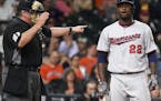 Minnesota Twins' Miguel Sano (22) reacts after being called out on strikes by home plate umpire Hunter Wendelstedt in the eighth inning of a baseball 