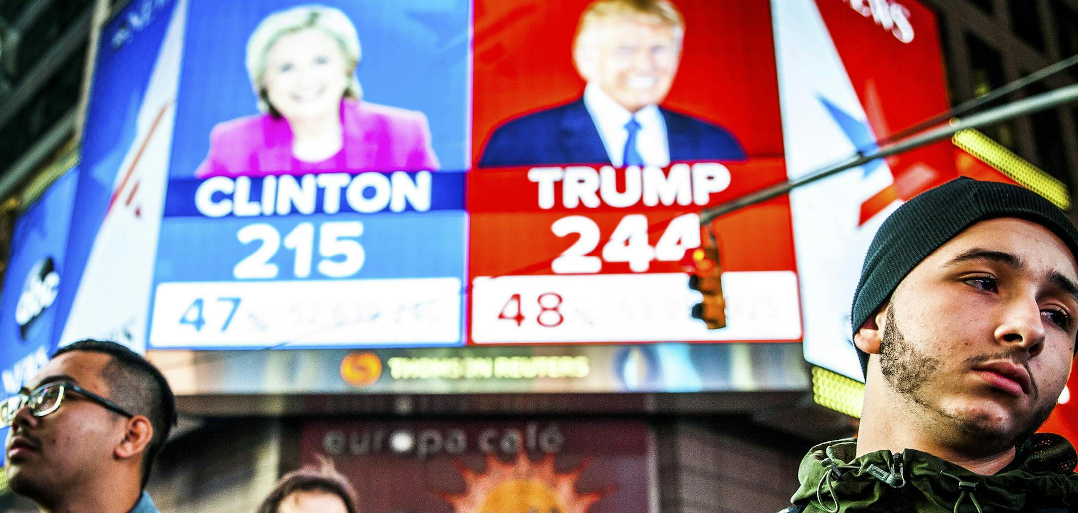 FILE-- People watch election results at Times Square in New York, Nov. 9, 2016. Clinton has followed Al Gore as the second Democratic presidential candidate in modern history to be defeated by a Republican who earned fewer votes, in his case by George W. Bush. Even President-elect Donald Trump, who won the electoral vote but lost the popular vote, called the system ìa disaster for a democracyî in 2012. (George Etheredge/The New York Times) ORG XMIT: MIN2016111012284738