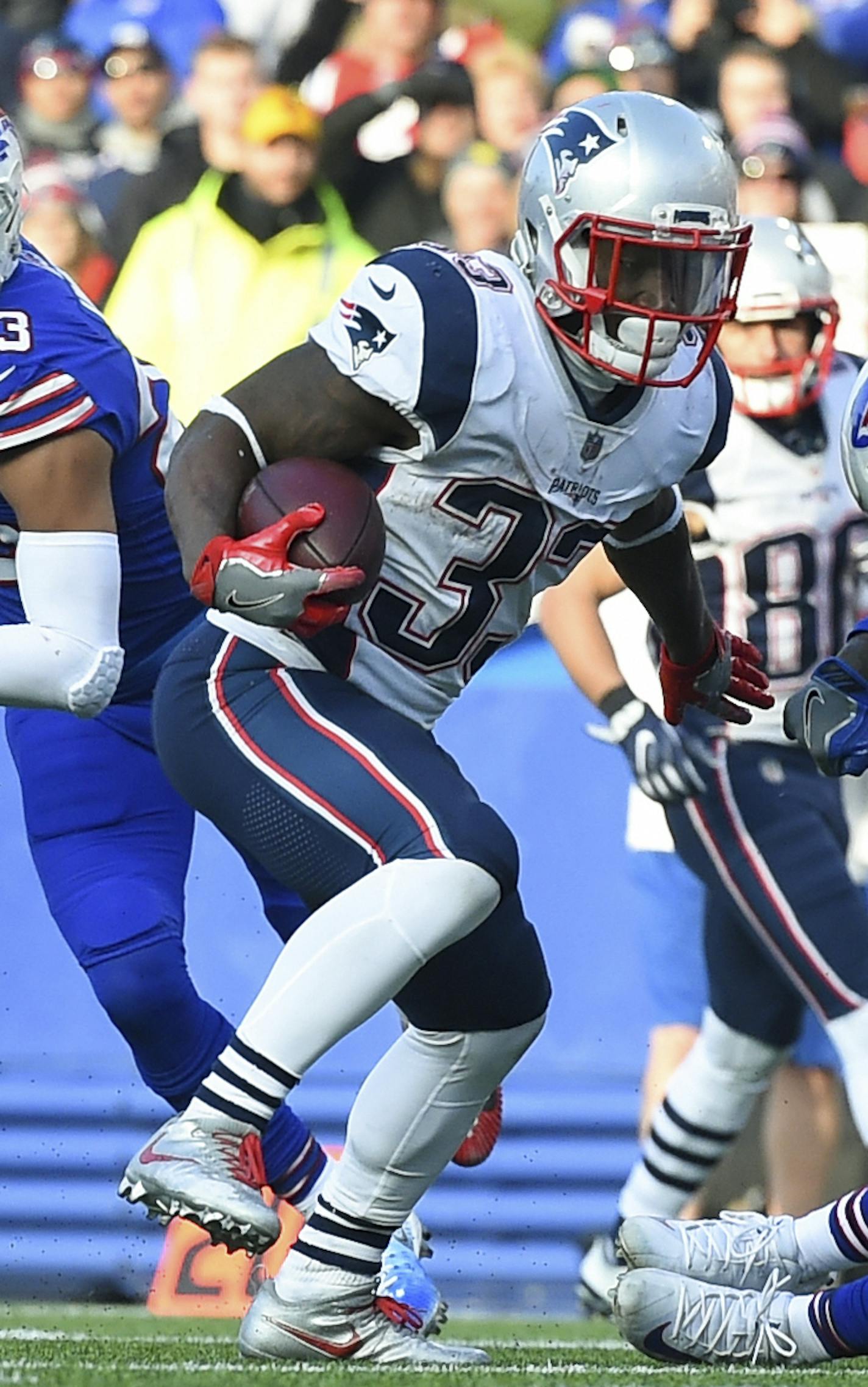 New England Patriots running back Dion Lewis (33) runs with the ball near the goal line against the Buffalo Bills during the second half of an NFL football game, Sunday, Dec. 3, 2017, in Orchard Park, N.Y. The Patriots won 23-3. (AP Photo/Rich Barnes) ORG XMIT: NYOTK