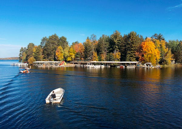 Ludlow's Island is accessible only by boat. A wooden Chris-Craft picks up guests on a dock near where they park and a separate boat (pictured) ferries