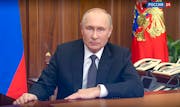In this image made from a video released by the Russian Presidential Press Service, Russian President Vladimir Putin addresses the nation in Moscow, R