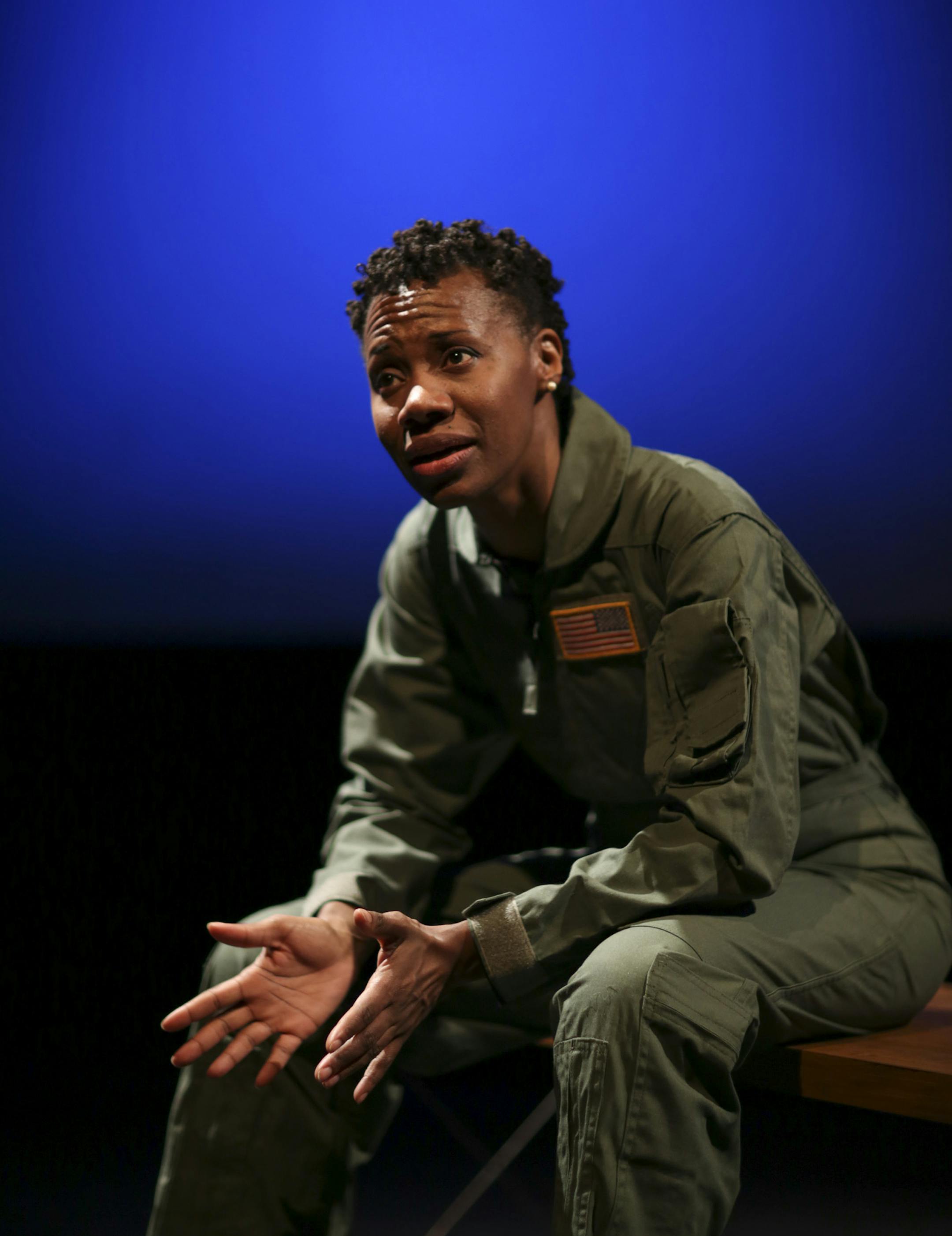 Sha Cage in "Grounded" during a dress rehearsal Monday night. ] JEFF WHEELER ‚Ä¢ jeff.wheeler@startribune.com Sha Cage in "Grounded," is the star and only actor in George Brant's new play about a female fighter pilot whose career is interrupted by a pregnancy. Cage plays a pilot who becomes a drone operator, working in the arid landscape outside of Las Vegas to eliminate bad guys 8,000 miles away in the sands of the Middle East. Wendy Knox of Frank Theatre directed the first run