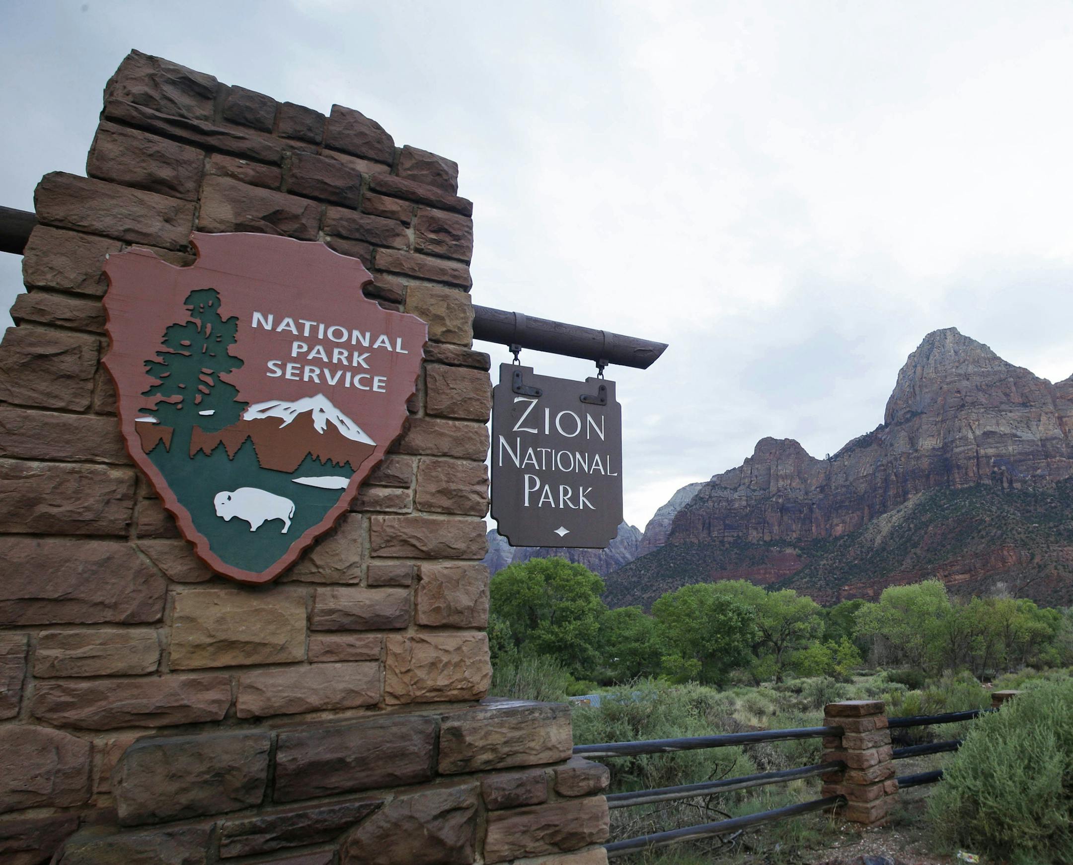 FILE - This Sept. 15, 2015, file photo, shows Zion National Park near Springdale, Utah. Zion National Park announced Monday, Marc h 23, 2020, it is closing its campgrounds and part of a popular trail called Angel's Landing that is often crowded with people. The top part of the hike that is being closed is bordered by steep drops and ascends some 1,500 feet (457 meters) above the southern Utah park's red-rock cliffs, offering sweeping views.(AP Photo/Rick Bowmer, File)