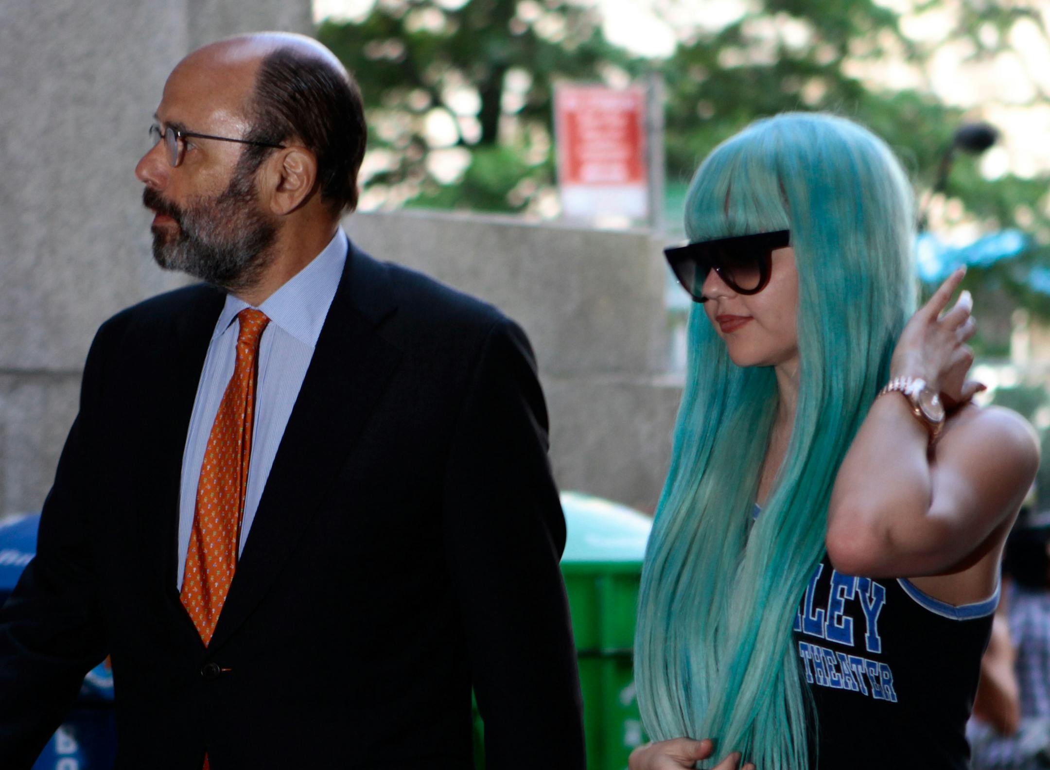FILE - In a Tuesday, July 9, 2013 file photo, Amanda Bynes, accompanied by attorney Gerald Shargel, arrives for a court appearance in New York on allegations that she chucked a marijuana bong out the window of her 36th-floor Manhattan apartment. Bynes has been hospitalized for a mental health evaluation after deputies said she started a small fire in the driveway of a home in Southern California. Ventura County sheriff's Capt. Don Aguilar says deputies responding to a call Monday night, July 22,
