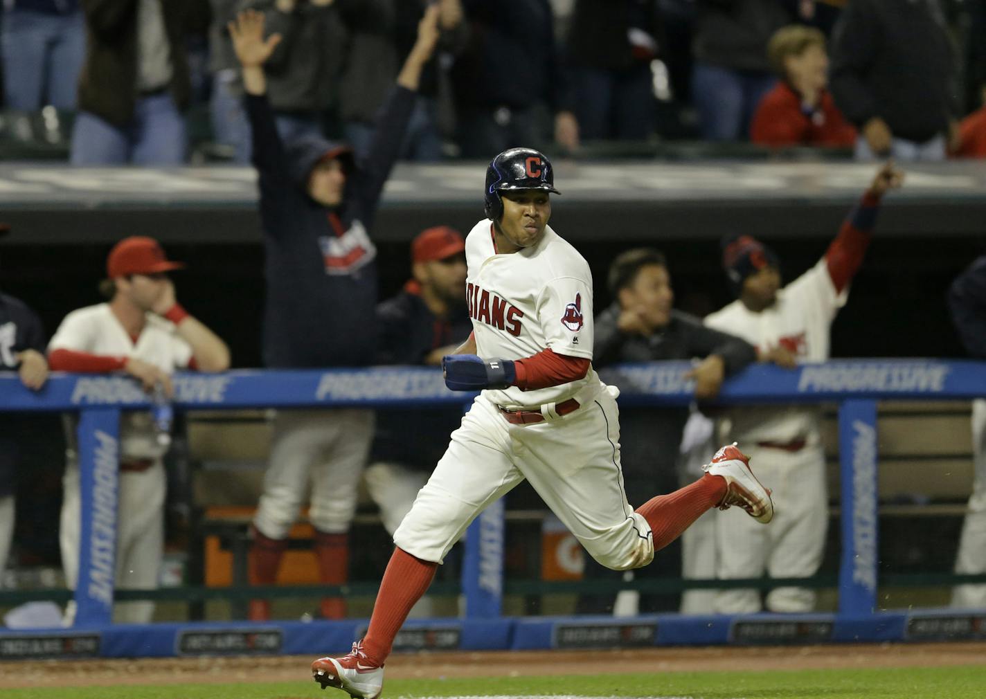 Cleveland Indians' Jose Ramirez scores on a two-run double hit by Marlon Byrd in the eighth inning of a baseball game against the Minnesota Twins, Friday, May 13, 2016, in Cleveland. (AP Photo/Tony Dejak)