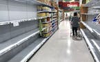 Empty shelves for high demand products, such as toilet paper, bottled water and hand sanitizer, at the Publix in Maitland, Fla., on April 2, 2020. (Jo