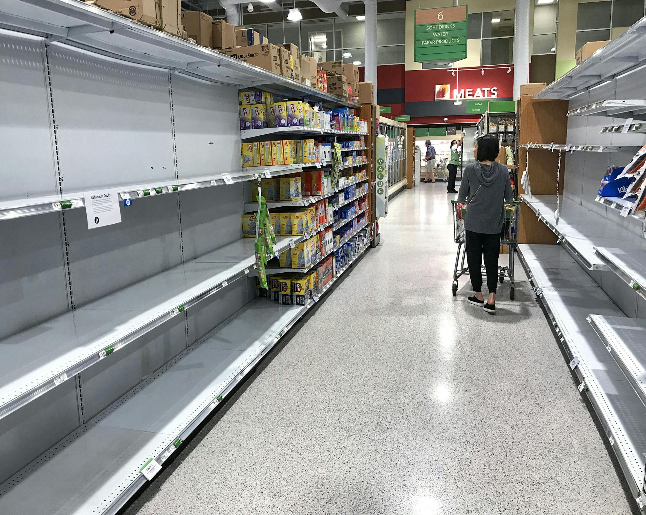 Empty shelves for high demand products, such as toilet paper, bottled water and hand sanitizer, at the Publix in Maitland, Fla., on April 2, 2020. (Joe Burbank/Orlando Sentinel/TNS) ORG XMIT: 1698862