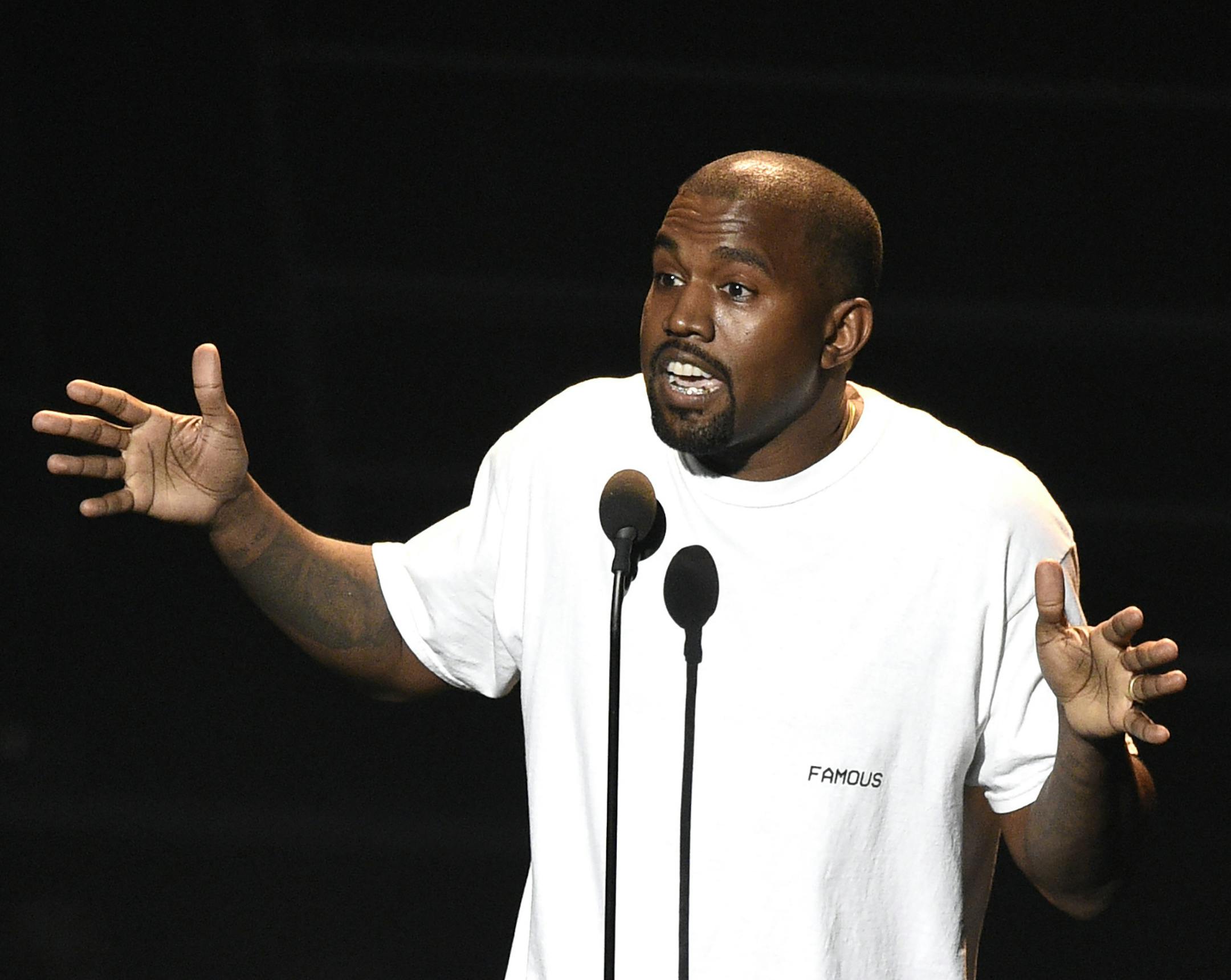 FILE - In this Aug. 28, 2016, file photo. Kanye West appears at the MTV Video Music Awards at Madison Square Garden in New York. West responded to critical tweets from his former protege Kid Cudi by telling the fellow rapper never to mention him during a show in Tampa, Fla., on Sept, 14, 2016. (Photo by Chris Pizzello/Invision/AP, File)