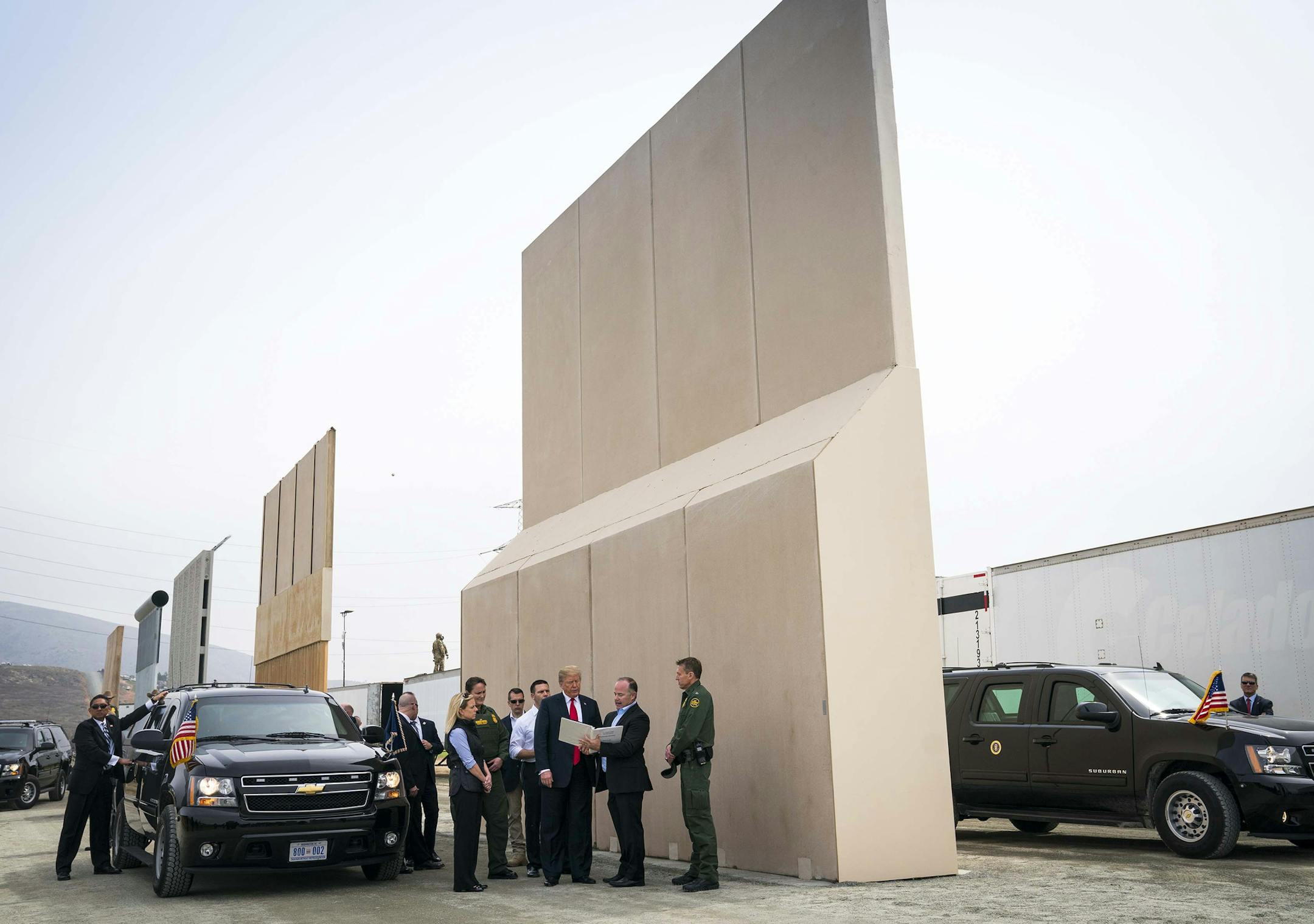 FILE -- President Donald Trump views border wall prototypes in the border neighborhood of Otay Mesa near San Diego, March 13, 2018. "The president still says 'wall,'" John Kelly, the outgoing White House chief of staff, said in an interview with the Los Angeles Times. "But we left a solid concrete wall early on in the administration." His comments come as a partial government shutdown caused by a fight over a border barrier drags into a second week. (Doug Mills/The New York Times)