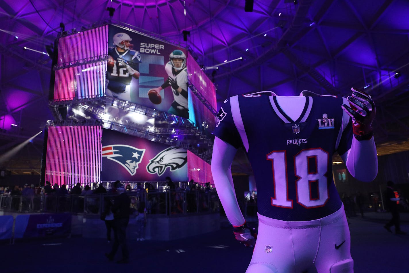 A Patriots mannequin for fans to pose in stood near the line for photos of the Vince Lombardi Trophy at the Super Bowl Experience.