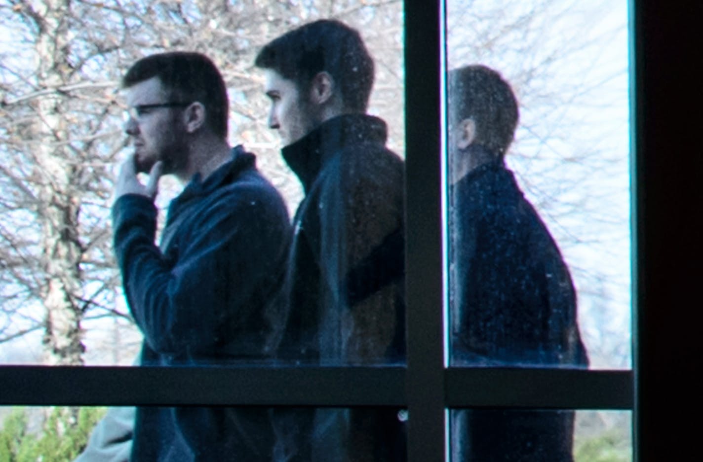 Philip Nelson, second from left, exits the Blue Earth courthouse by a side door as his attorney talked with the media. He received 100 hours of community service and no jail time in the beating of Issac Kolstad. ] GLEN STUBBE * gstubbe@startribune.com Former Minnesota quarterback Philip Nelson was sentenced Monday for his role in the bar-closing time assault on Issac Kolstad.