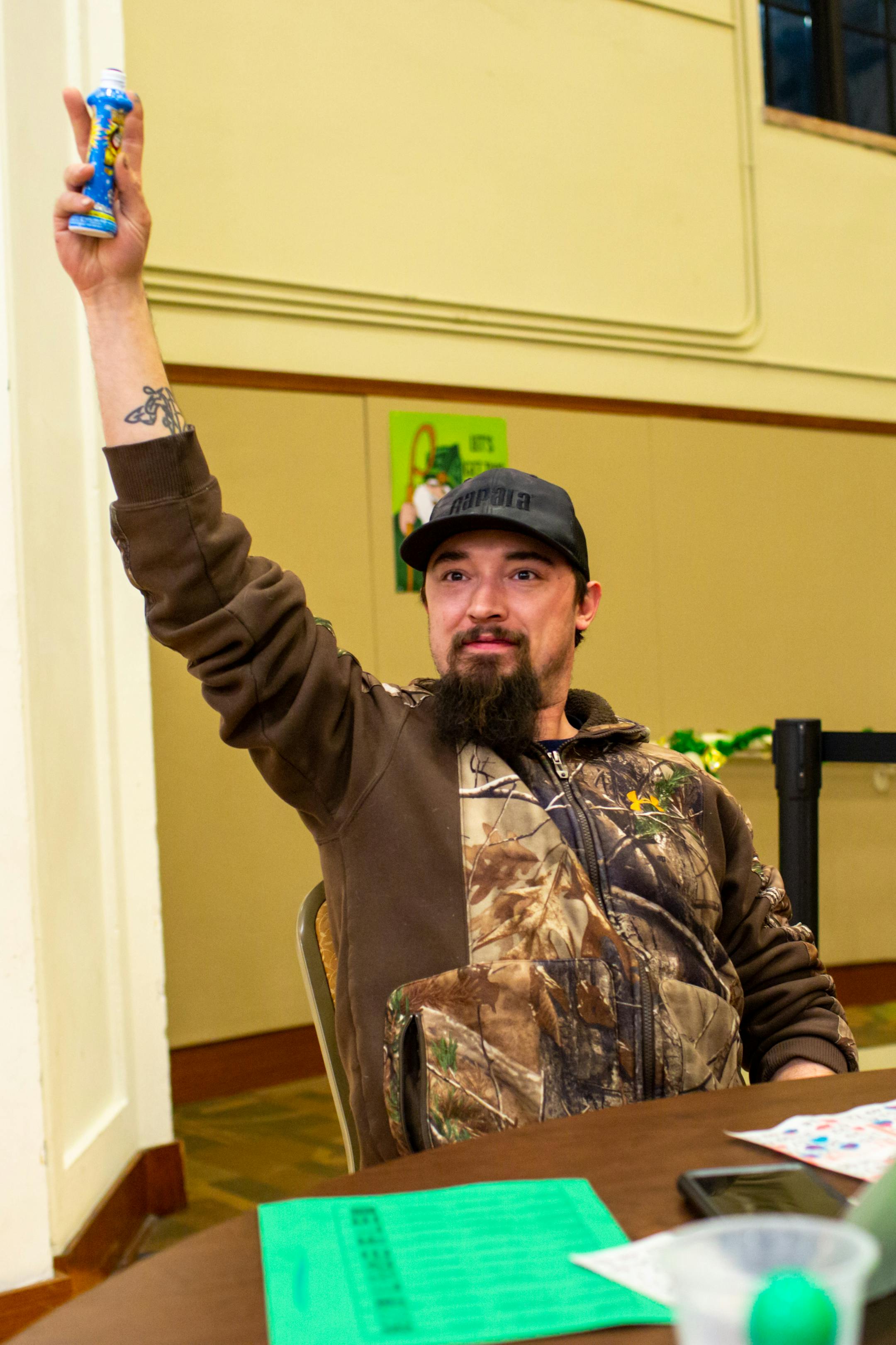 Corey Finke raises up his blotter after winning Bingo.
