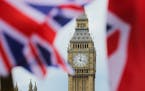 The British nationals flag flies in front of the Big Ben clock tower on June 24, 2016 in London. In a referendum the day before, Britons voted by a na