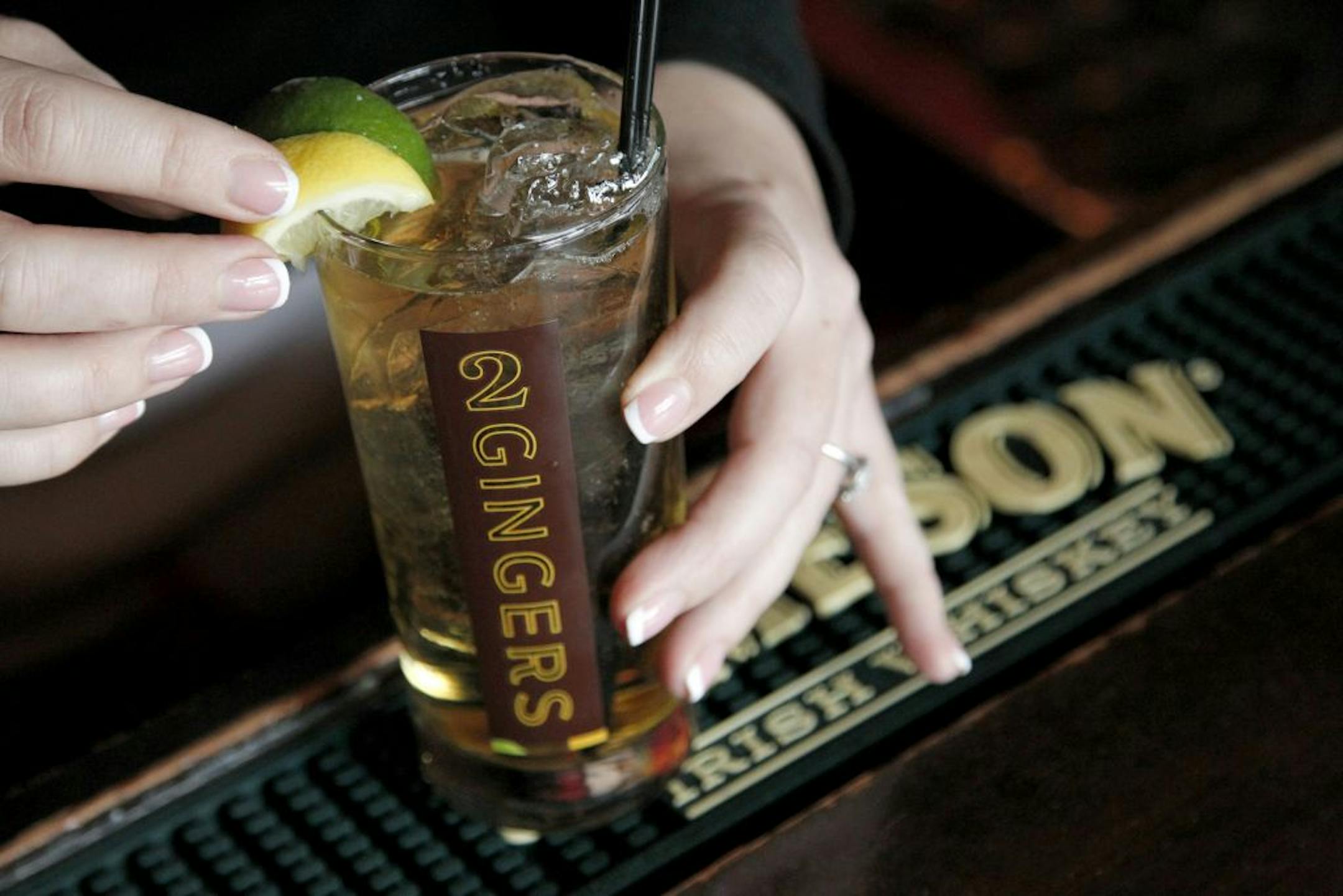 Bartender Elle Maeyaert prepared a "Big Ginger" for photographer at The Local in downtown Minneapolis on Wednesday. Kieran Folliard, through his businesses A Kieran Collection and 2 Gingers Whiskey, sued Jameson in federal court Wednesday alleging the giant distiller's "Big Jameson Ginger" cocktail improperly mimics Folliard's signature "The Big Ginger" drink which his pubs have been selling since 2005.