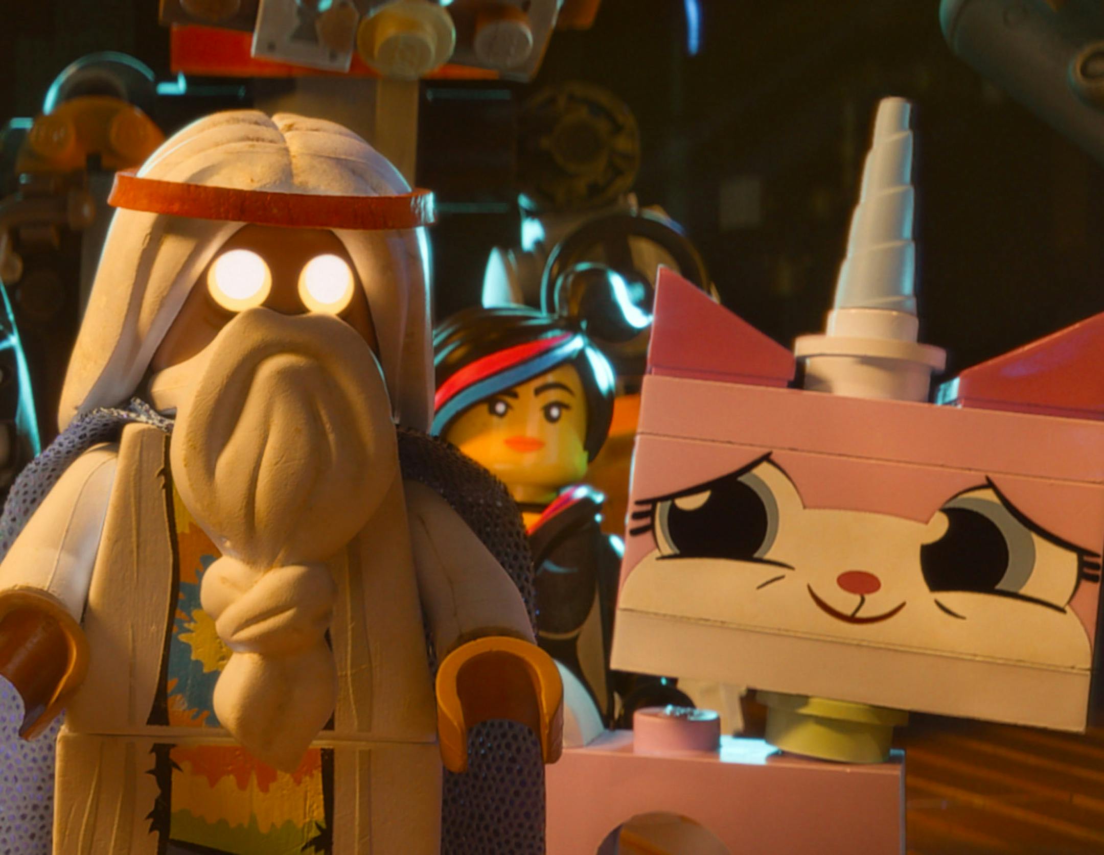 This image released by Warner Bros. Pictures shows characters, from left, Benny, voiced by Charlie Day, Batman, voiced by Will Arnett, Vitruvius, voiced by Morgan Freeman, Wyldstyle, voiced by Elizabeth Banks and Unikitty, voiced by Alison Brie, in a scene from "The Lego Movie." (AP Photo/Warner Bros. Pictures)