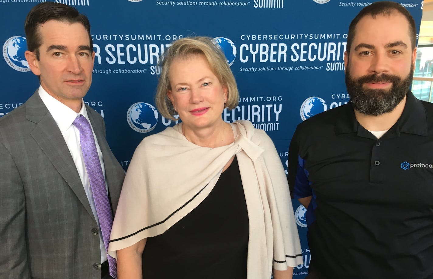 Phil Schenkenberg of Briggs, Eileen Manning, owne rof The Event Group and host of the Cyber Security Summit; and Eric Ebner, a founder and chief technology officer of Protocol 46. Photo: Neal.St.Anthony@startribune.com