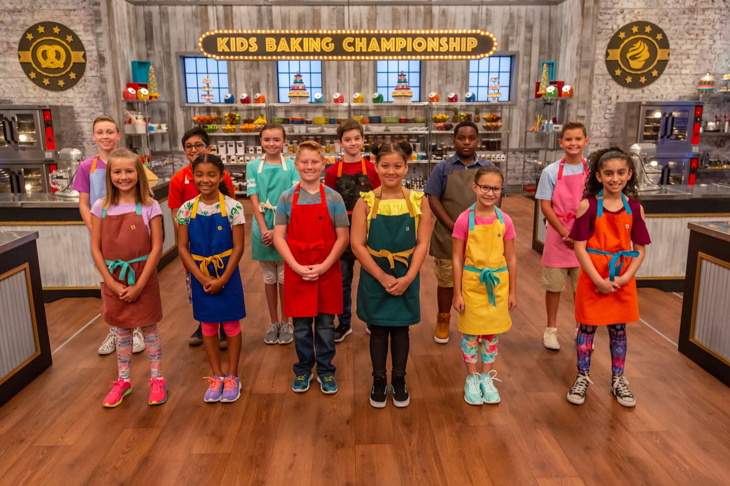 Kids Baking Championship, Season 6 contestants include Paige Goehner, 11, Blaine (front left) and Meadow Roberts, 10, Minneapolis (front center).