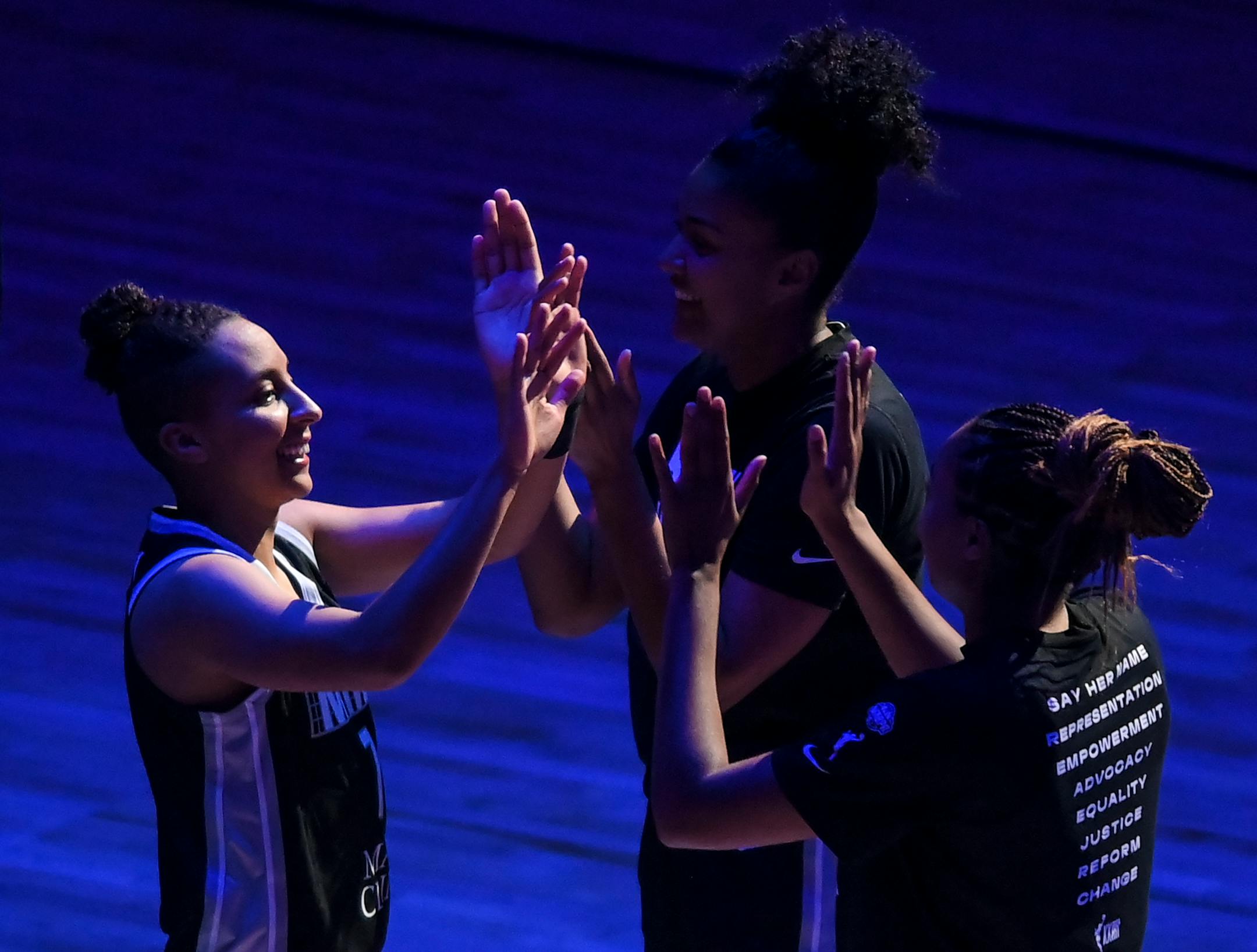 Minnesota Lynx guard Layshia Clarendon, left, high fived teammates as they were introduced Wednesday night as a starter.