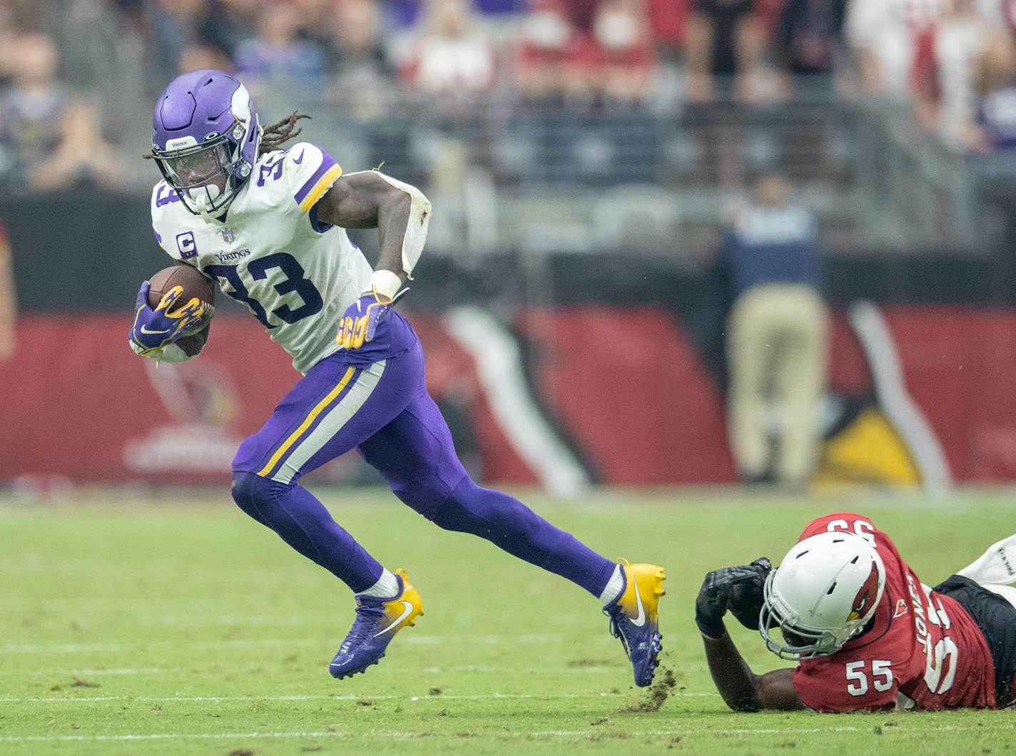 Vikings running back Dalvin Cook (33) broke away from the grasps of Cardinals linebacker Chandler Jones (55) in the third quarter as Minnesota Vikings took on the Arizona Cardinals at State Farm Stadium, Sunday, September 19, 2021 in Glendale, AZ. ] ELIZABETH FLORES • liz.flores@startribune.com