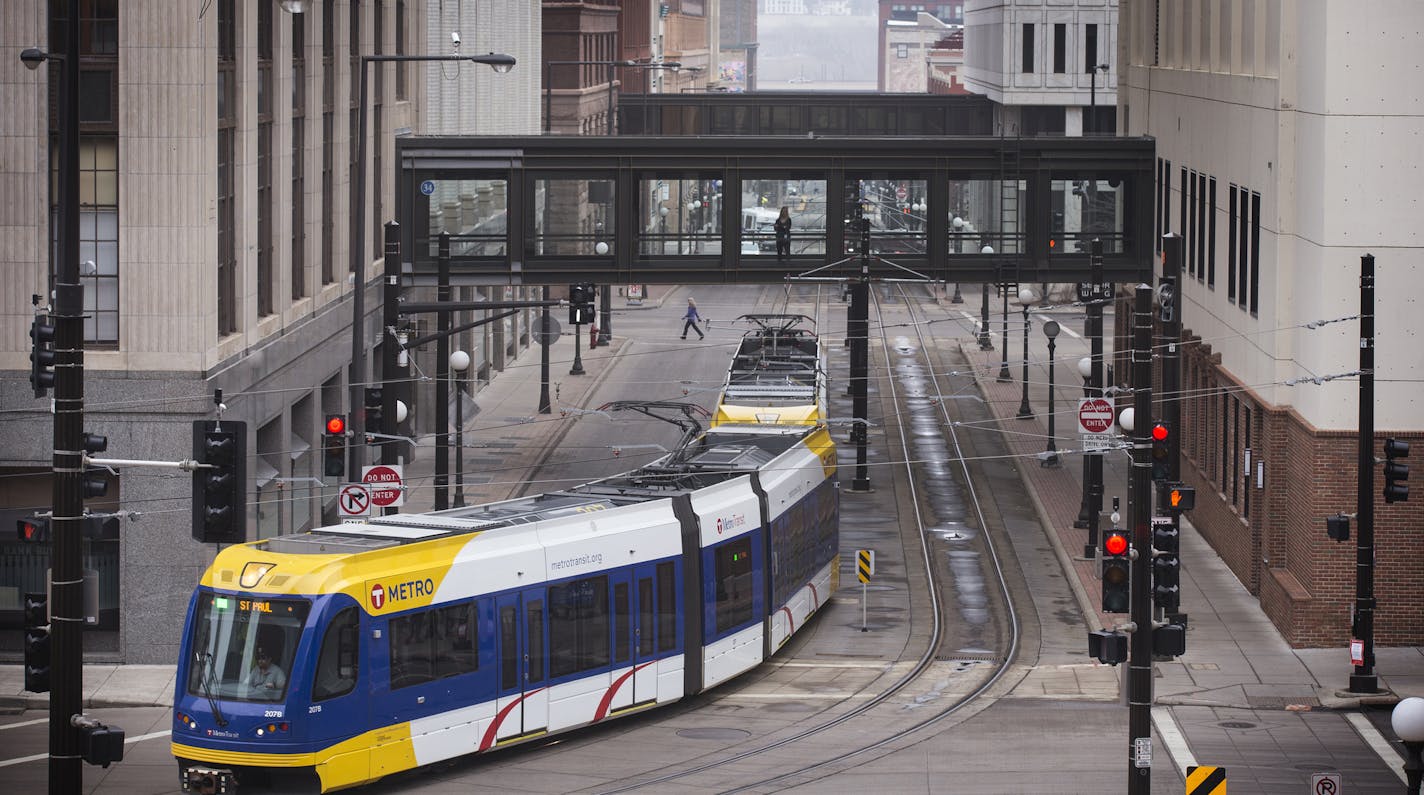 The Metro Green Line turns off 4th Street in downtown St. Paul. ] (Leila Navidi/Star Tribune) leila.navidi@startribune.com BACKGROUND INFORMATION: Monday, March 14, 2016 in downtown St. Paul. A group of building and business owners along the stretch of 4th Street in downtown St. Paul hope to change its status as a dead zone between bustling areas. On Monday they debuted a plan for what they call the 4th Street Market District. The members of the business community now hope city officials will bu