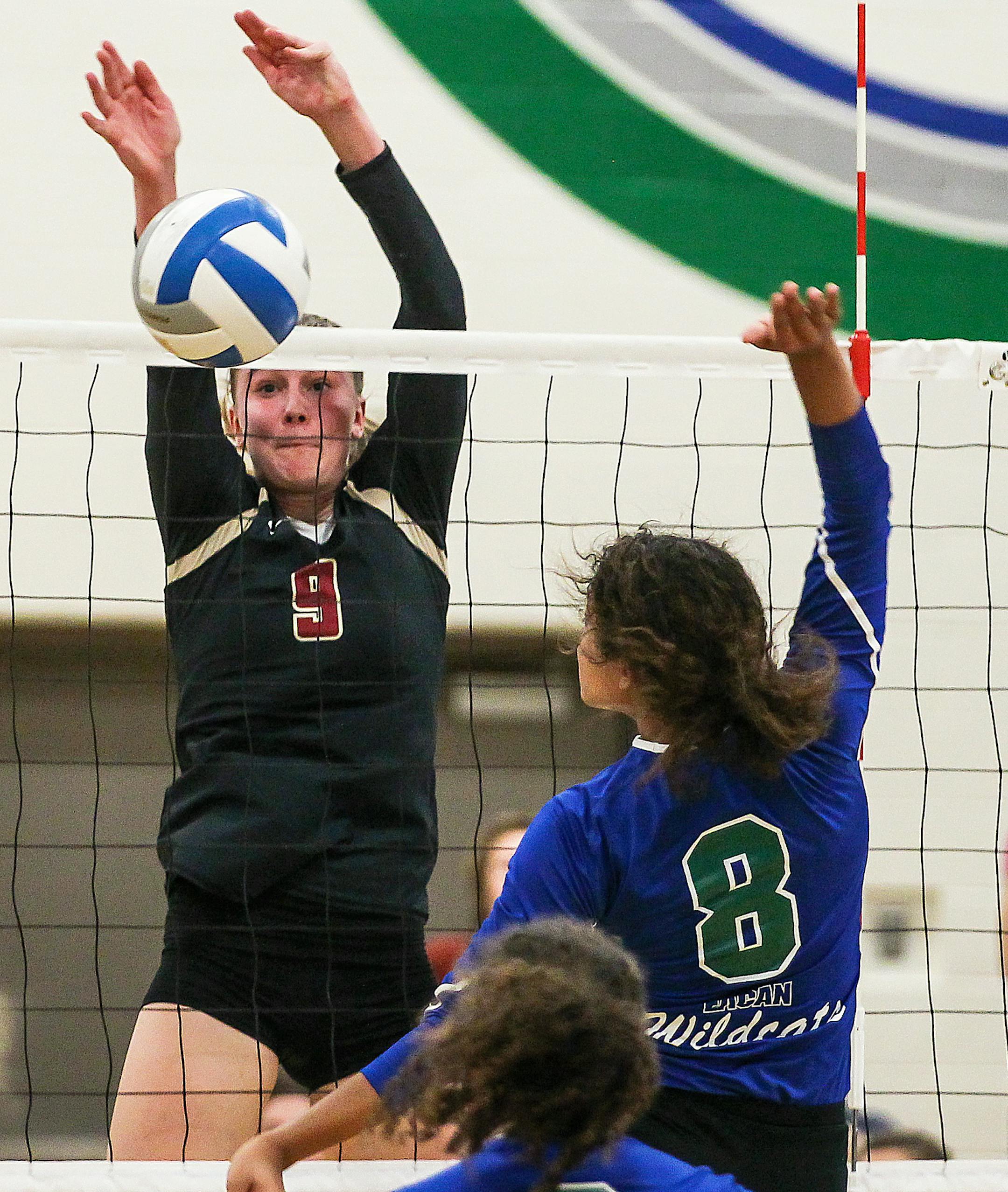 Lakeville South at Eagan volleyball, 10-13-16, Photo by Mark Hvidsten, SportsEngine. Jenny Mosser (left) of Lakeville North, Brie Orr (#8, right) of Eagan.