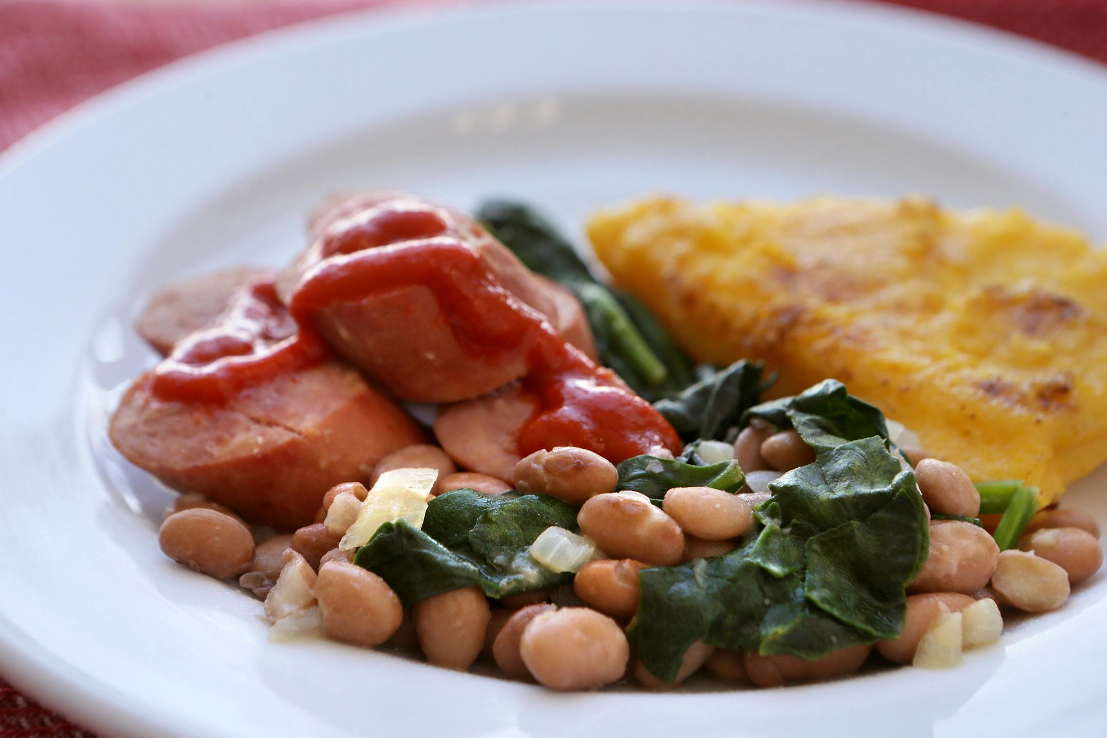 Sausage, Beans and Polenta. (Cristina Fletes-Boutte/St. Louis Post-Dispatch/TNS) ORG XMIT: 1164829