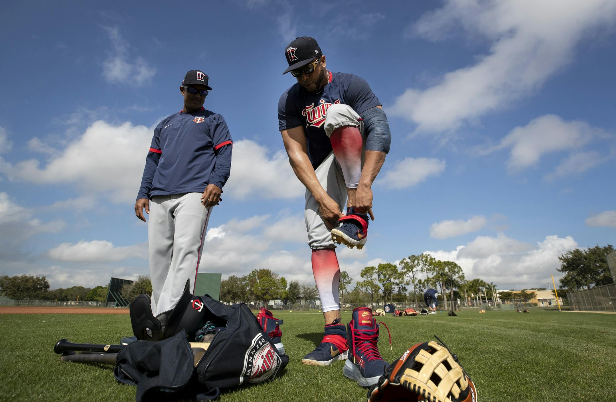 Minnesota Twins' Nelson Cruz put on cleats for practice.