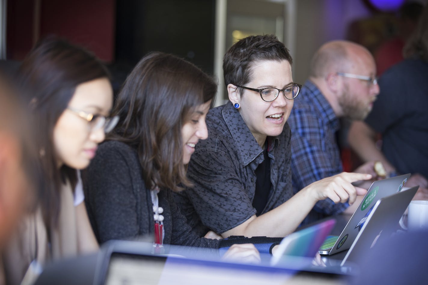 Front end developer Kjrsten Holt works with colleagues in the kitchen at the Clockwork office in Minneapolis. ] (Leila Navidi/Star Tribune) leila.navidi@startribune.com BACKGROUND INFORMATION: Tuesday, June 7, 2016 in Minneapolis. Clockwork Active Media once again topped the Top Workplaces list for small businesses.