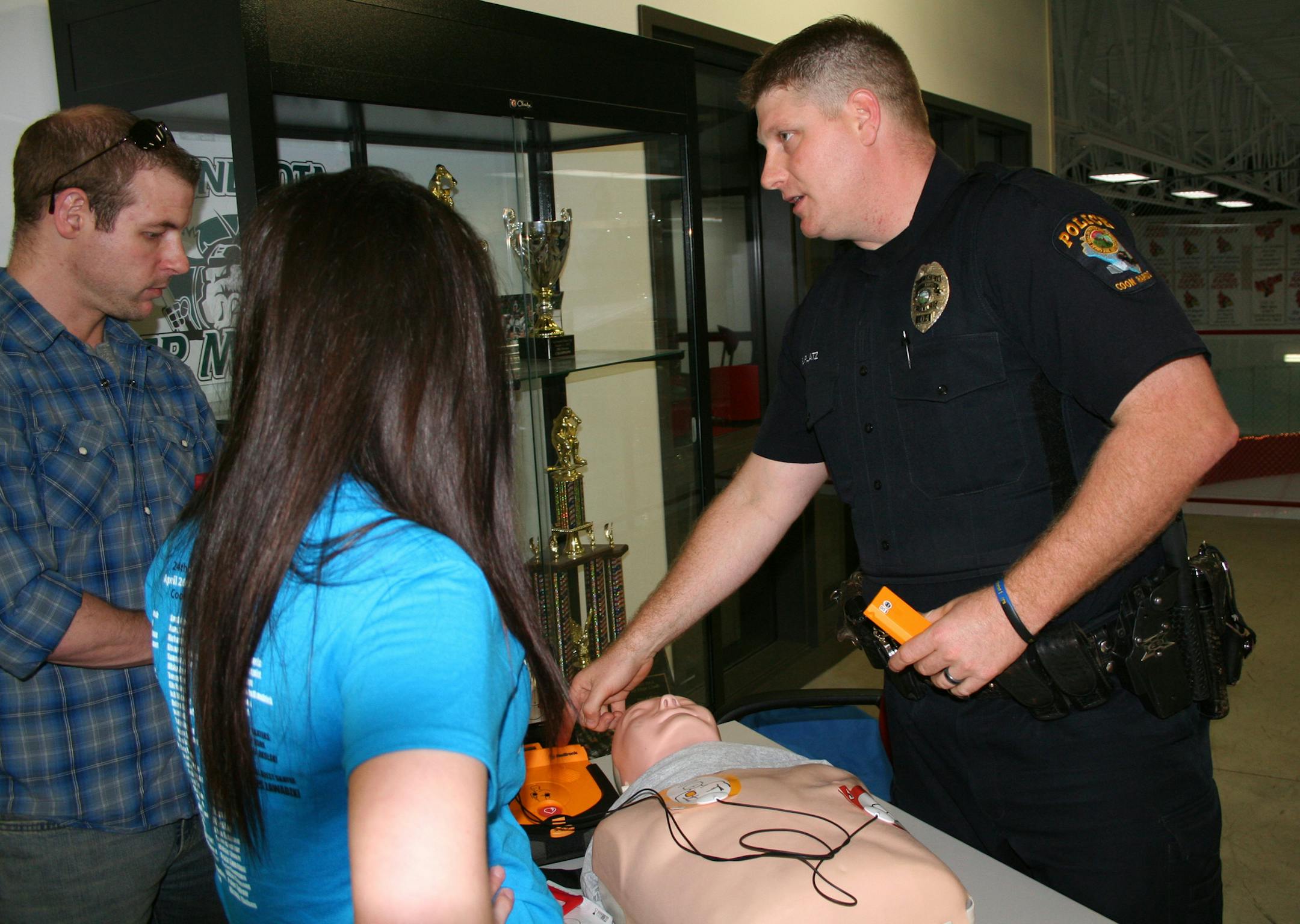 Coon Rapids Officer Bryan Platz teaches hands-only CPR and AED use. He is leading a charge to have the city designated Heart Safe by the Minnesota Department of Health. ORG XMIT: MIN1306281426212360