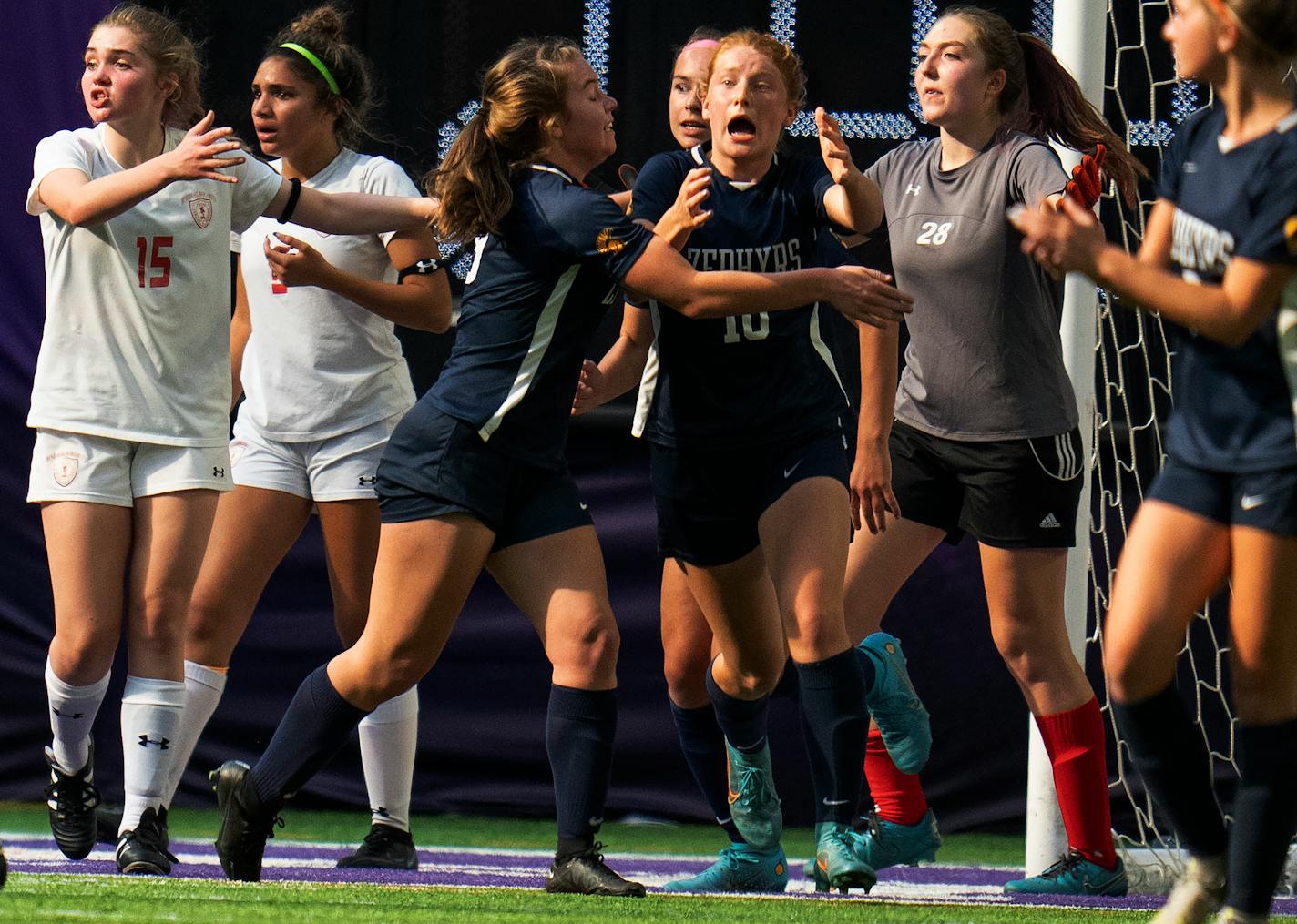 Aynslea Ulschmid, of Mahtomedi (10) celebrates with team Katelyn Beulke, (9) left after scoring a first half goal at U.S. Bank Stadium in Minneapolis.,Minn. on Wednesday November 2, 2022.