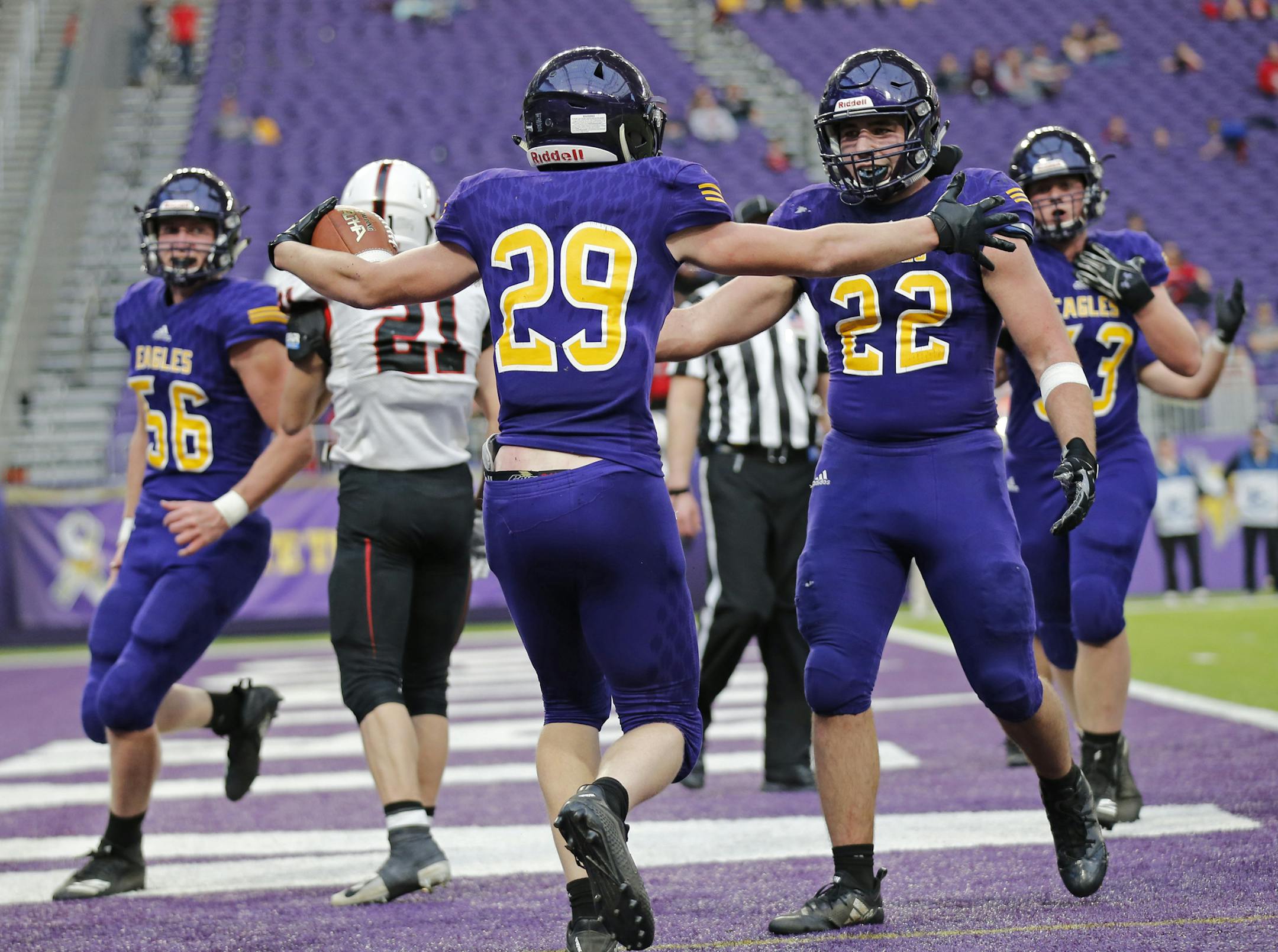 Rochester Lourdes running back Zach Jungels celebrated with teammates after scoring a touchdown in the first half. ] Shari L. Gross ï shari.gross@startribune.com Rochester Lourdes led Pierz 15-14 at the half in a 3A semifinal game inside U.S. Bank Stadium on Saturday, Nov. 17, 2018.