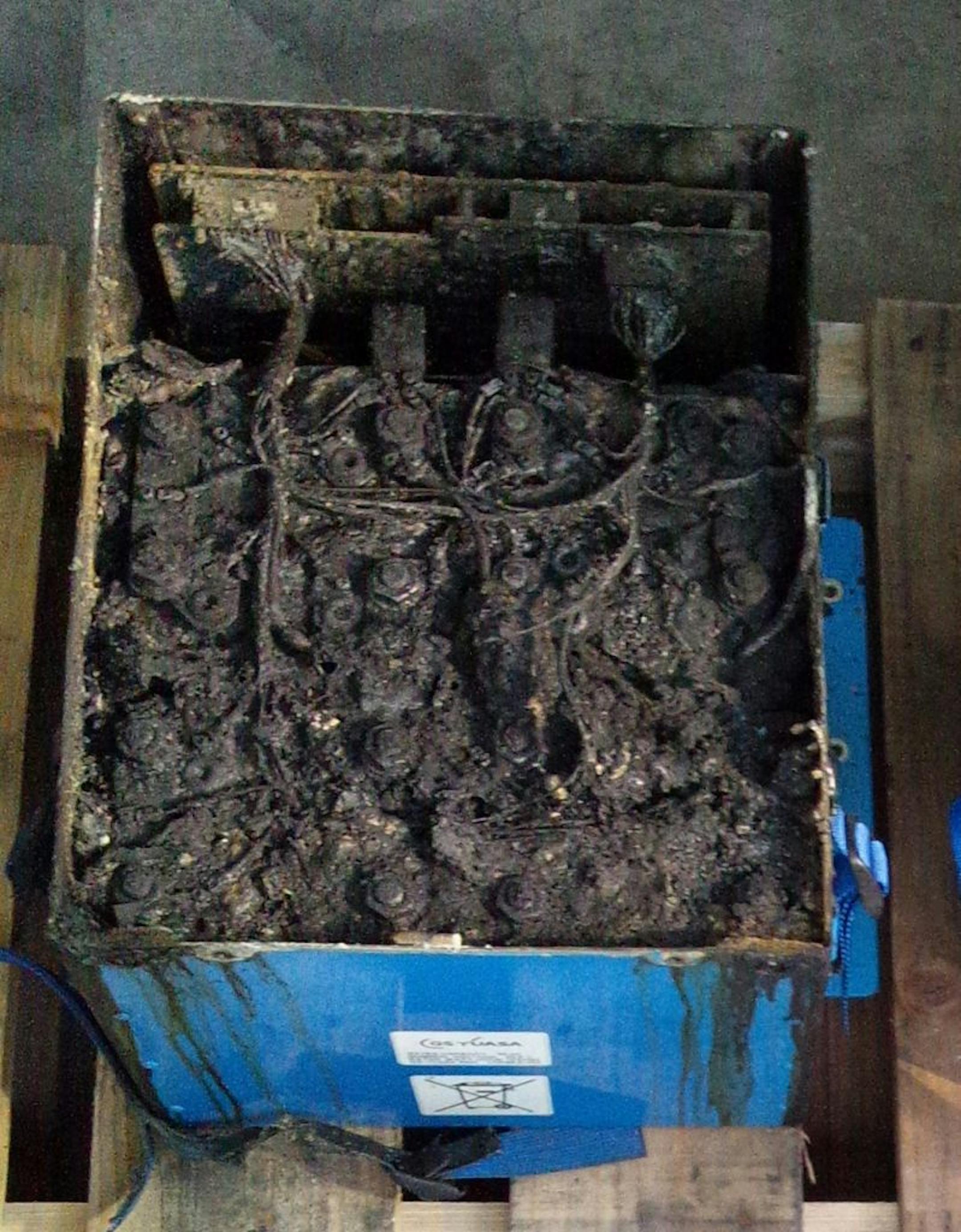 This Jan. 17, 2013 photo provided by the Japan Transport Safety Board shows the distorted main lithium-ion battery of the All Nippon Airways' Boeing 787 which made an emergency landing on Wednesday, Jan. 16, 2013 at Takamatsu airport in Takamatsu, western Japan. U.S. safety officials and Boeing inspectors joined a Japanese investigation Friday into the 787 jet at the center of a worldwide grounding of the technologically advanced aircraft. The pilot of the ANA plane made an emergency landing Wed