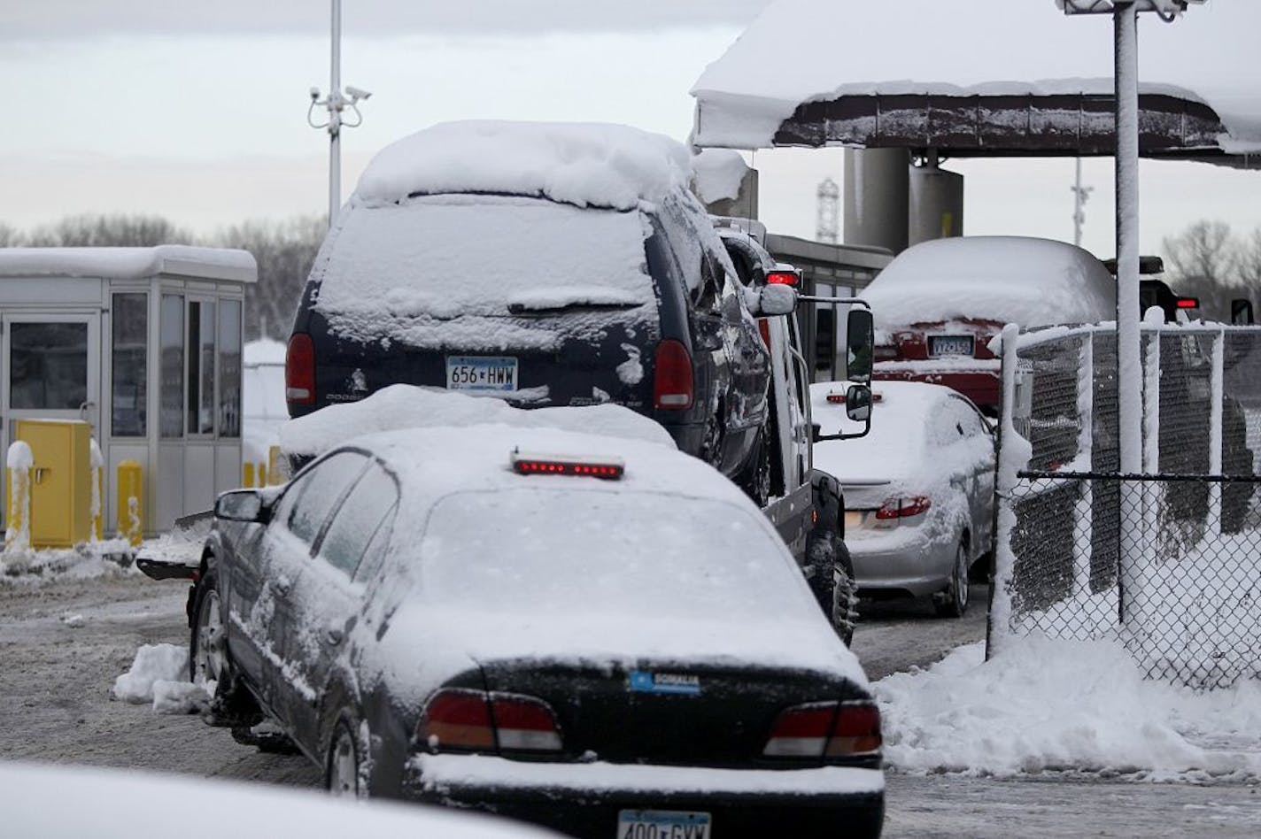 Dec. 10, 2012: Tow trucks loaded with cars made their way into the Minneapolis Impound lot.