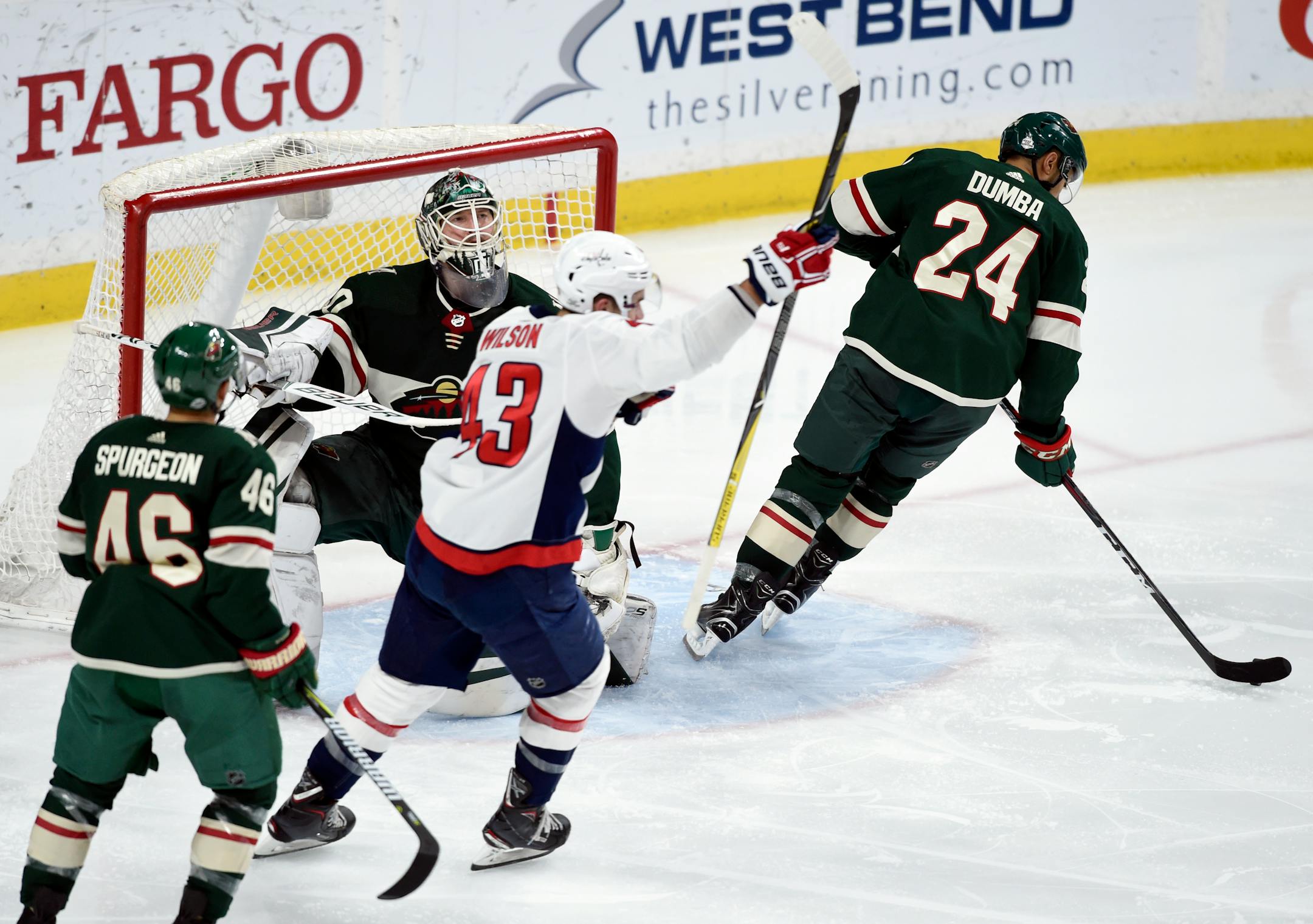 The Capitals' Tom Wilson (43) celebrates a goal as the Wild's Jared Spurgeon (46), goalie Devan Dubnyk (40) and Matt Dumba (24) react