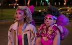 This image released by Netflix shows Betty Gilpin, left, and Alison Brie in a scene from "GLOW." On Tuesday, July 16, 2019, Gilpin was nominated for a