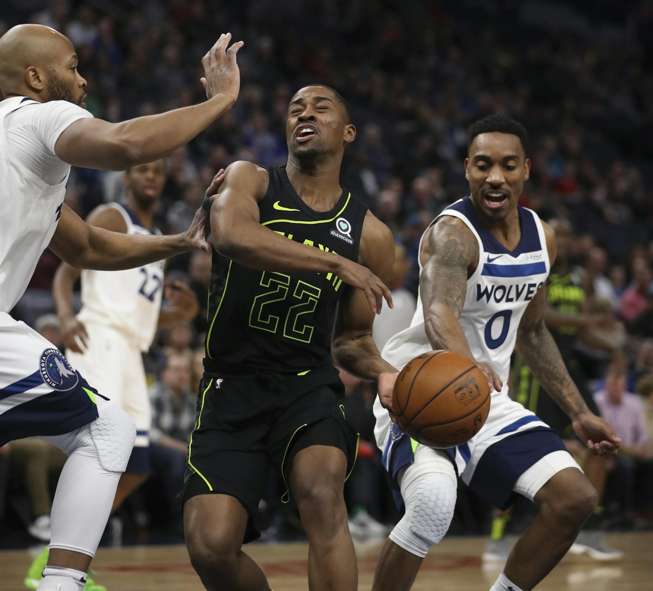 Minnesota Timberwolves guard Jeff Teague (0) fouled Atlanta Hawks guard Isaiah Taylor (22) in the first quarter when he swatted the ball away from him.