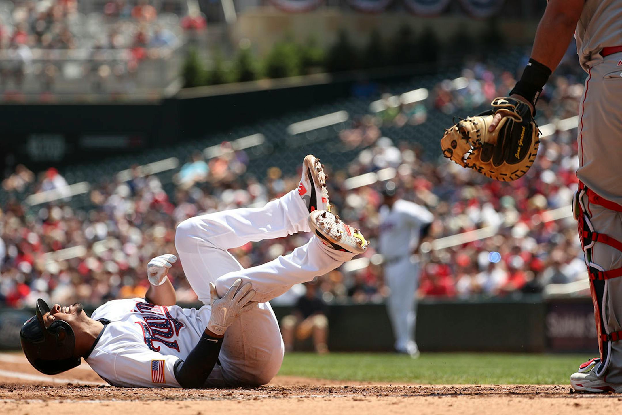 Minnesota Twins third baseman Eduardo Escobar (5) went down after he was hit by a pitch in the second inning.