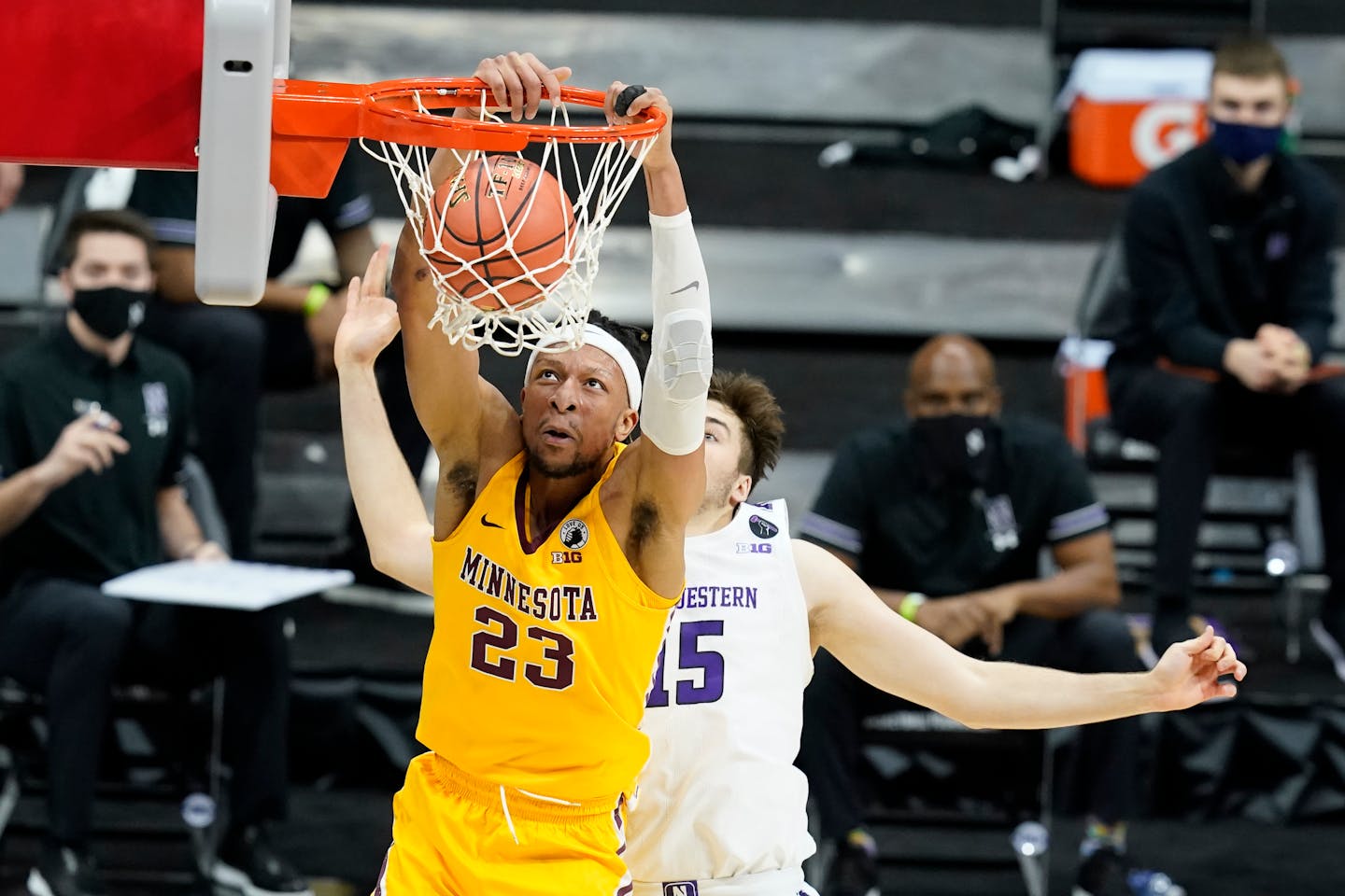 Minnesota's Brandon Johnson dunks against Northwestern's Ryan Young during the first half