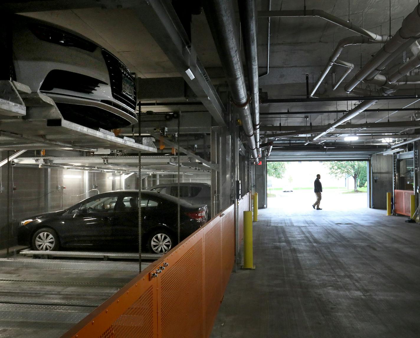 The parking garage at the M on Hennepin features the car matrix parking system that can shuffle parked cars on its two levels, allowing for residents to have 24/7 access to their vehicles and seen Thursday, Sept. 27, 2018, in Minneapolis, MN.] DAVID JOLES &#xef; david.joles@startribune.com When Schafer Richardson was doing site prep for an apartment building that would replace the Nye's Polonaise Room in Minneapolis, they ran into an unexpected problem: A thick deposit of bedrock that would make