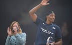 Minnesota Lynx center Sylvia Fowles waved to the crowd after WNBA commissioner Cathy Engelbert presented her with the trophy for being named WNBA Defe