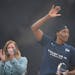 Minnesota Lynx center Sylvia Fowles waved to the crowd after WNBA commissioner Cathy Engelbert presented her with the trophy for being named WNBA Defe