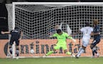 Minnesota United midfielder Kevin Molino (7) scored past Sporting Kansas City goalkeeper Richard Sanchez in the 97th minute, giving the Loons a 2-1 vi