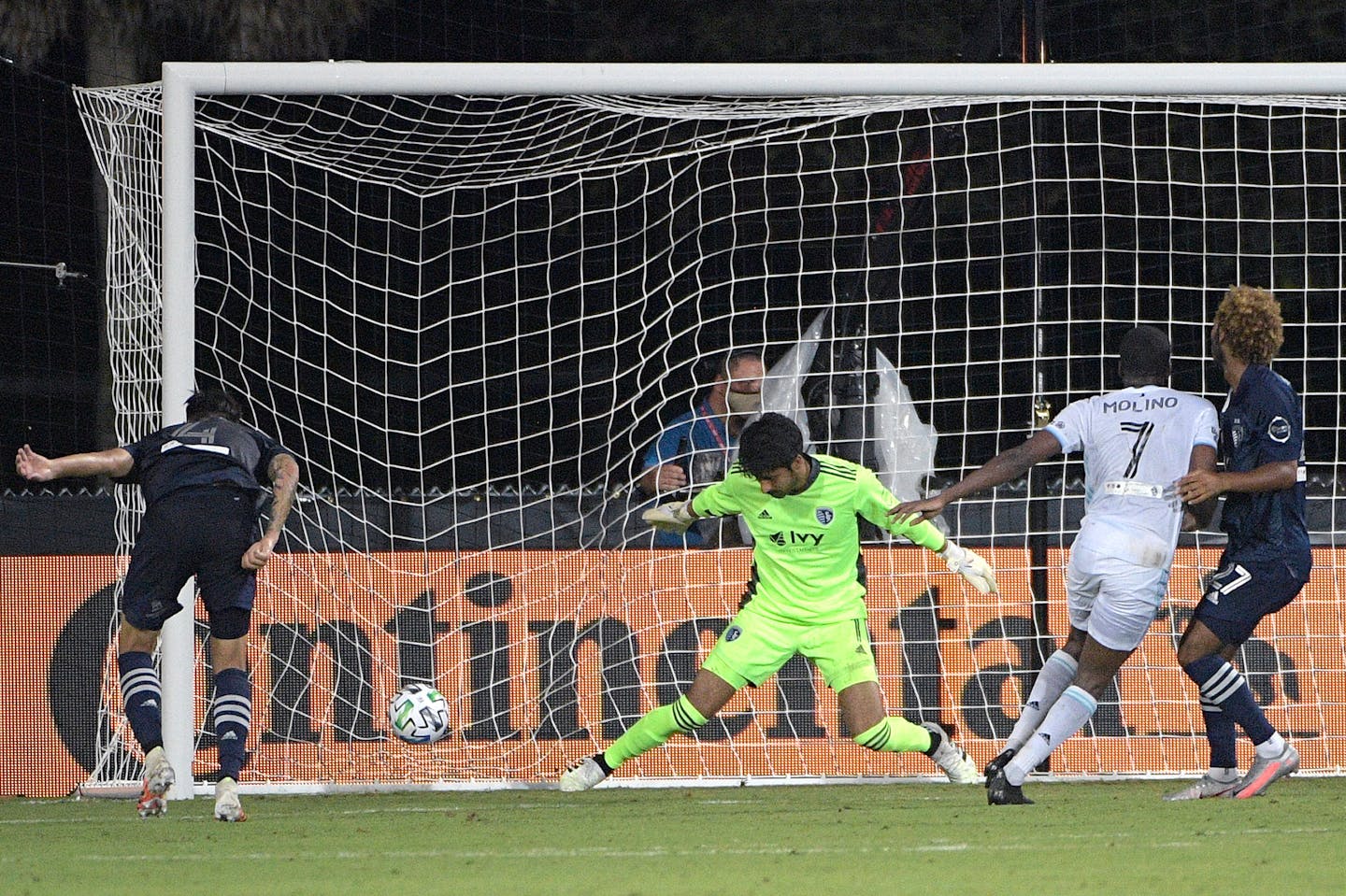 Minnesota United midfielder Kevin Molino (7) scored past Sporting Kansas City goalkeeper Richard Sanchez in the 97th minute, giving the Loons a 2-1 victory in Kissimmee, Fla., on Sunday.