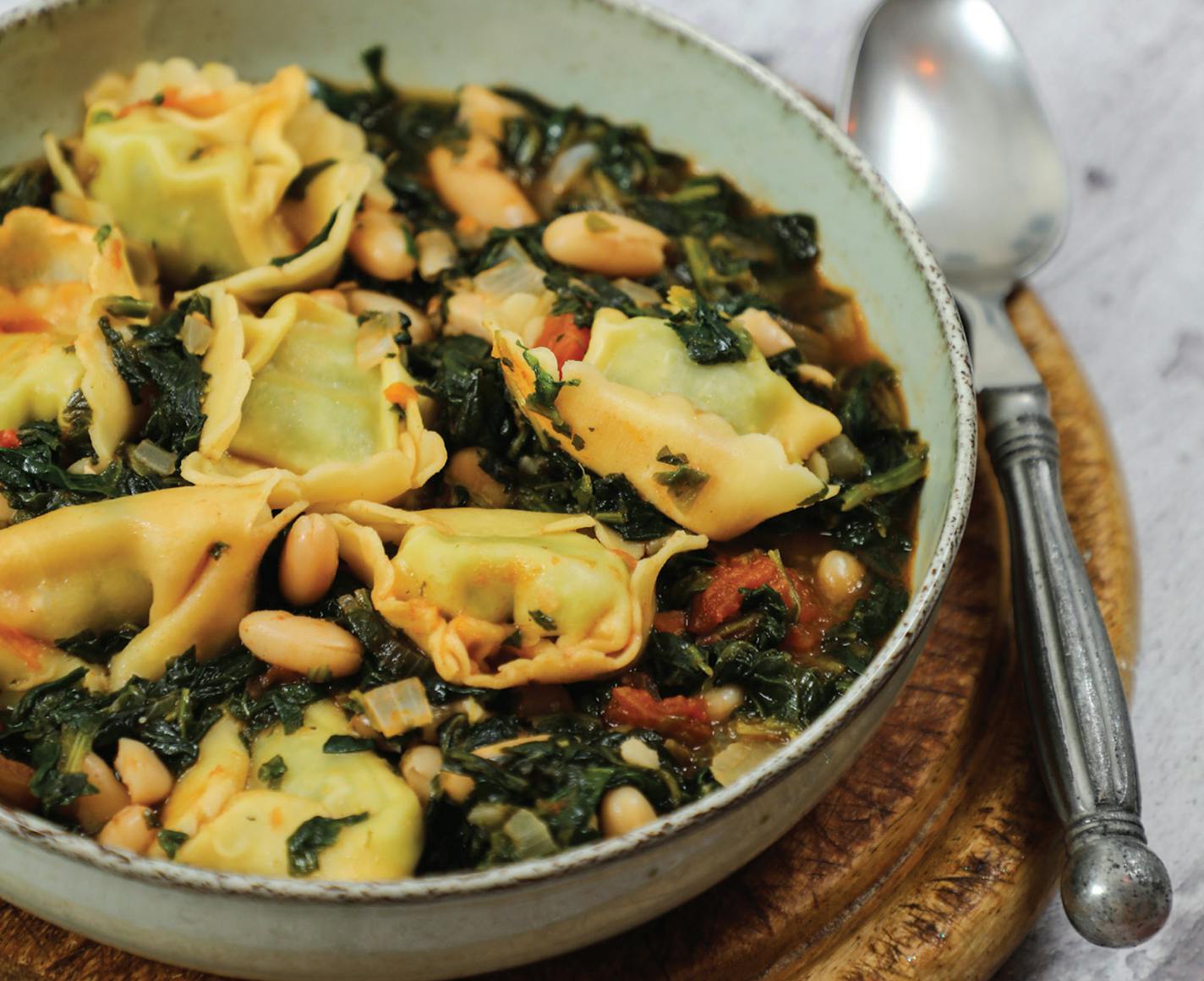 Hearty Black-Eyed Pea and Cheese Tortellini Soup. was inspired by "Scream 2" (1997). From "The Horror Movie Night Cookbook," by Richard S. Sargent (Ulysses, 2023).