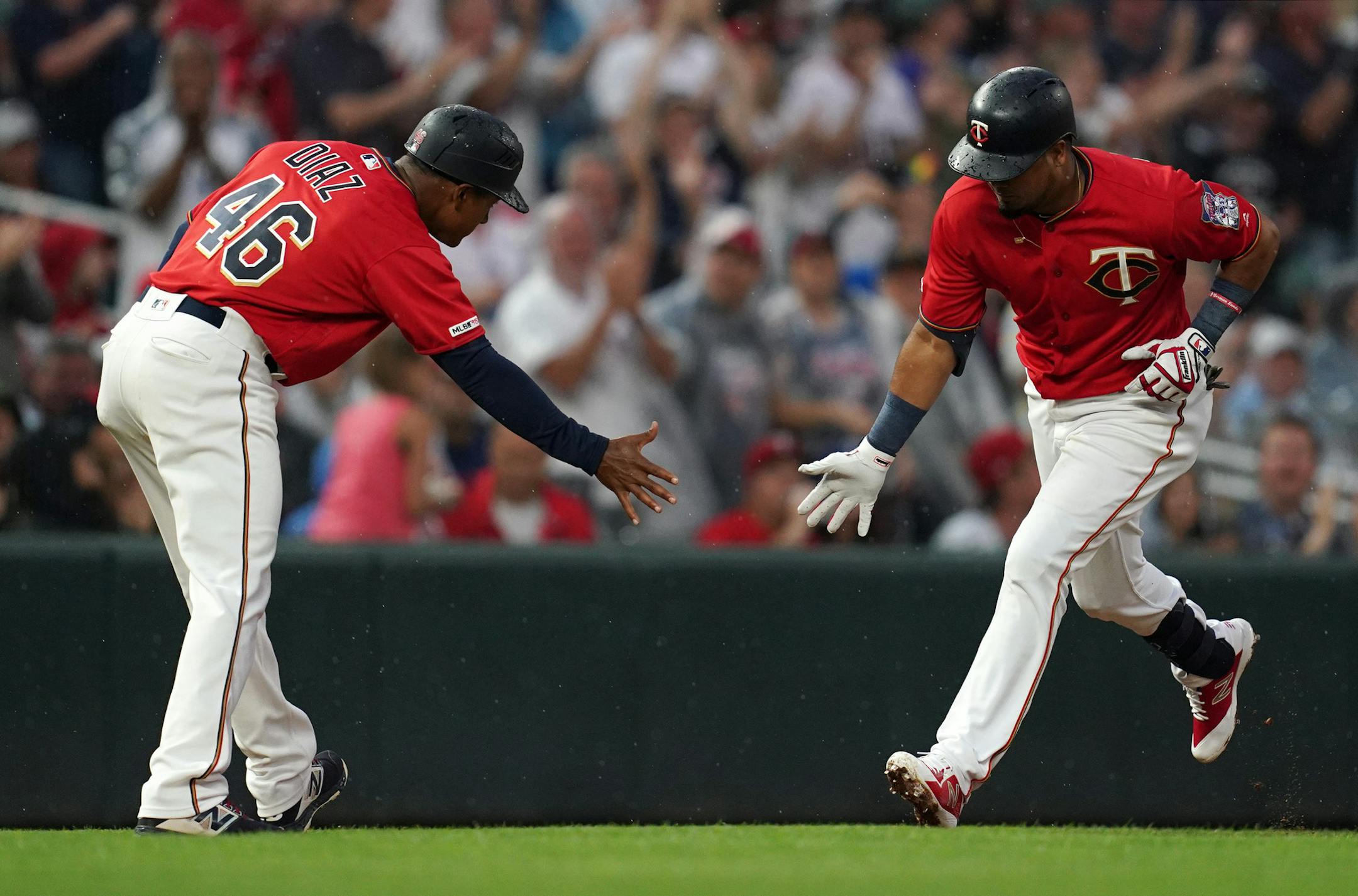 Minnesota Twins third baseman Luis Arraez (2) celebrated with Minnesota Twins third base coach Tony Diaz (46) after hitting a home run in the second inning. ] ANTHONY SOUFFLE &#x2022; anthony.souffle@startribune.com The Minnesota Twins played the Texas Rangers in an MLB game Friday, July 5, 2019 at Target Field in Minneapolis.