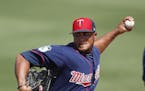 Minnesota Twins relief pitcher Adalberto Mejia (49) warms up in the bullpen during a spring training baseball game Miami Marlins Friday, March 10, 201