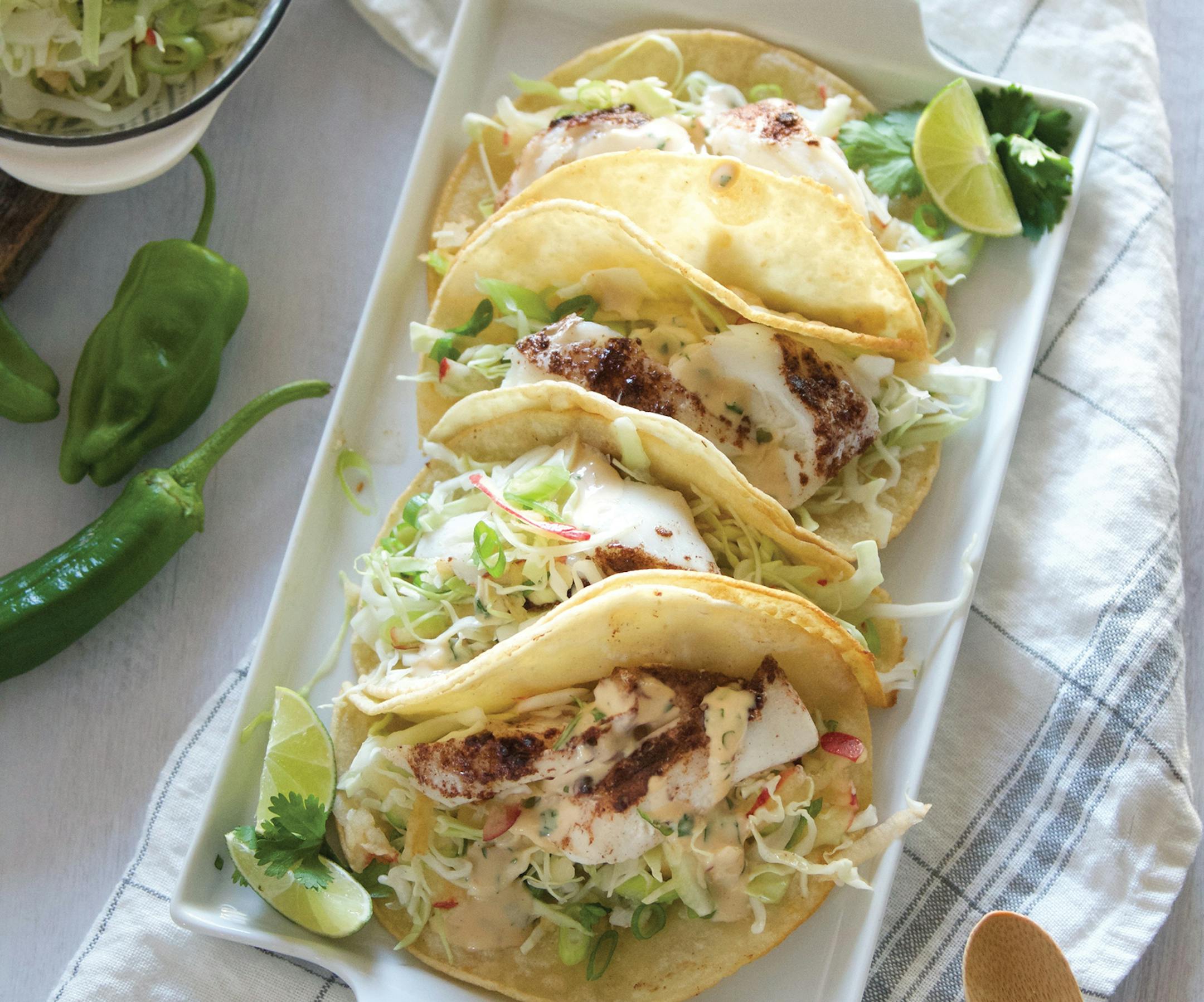 Roasted Five-Spice White Fish Tacos with Apple Cabbage Slaw from "For the Love of Seafood" by Karista Bennett (Countryman 2023).Provided