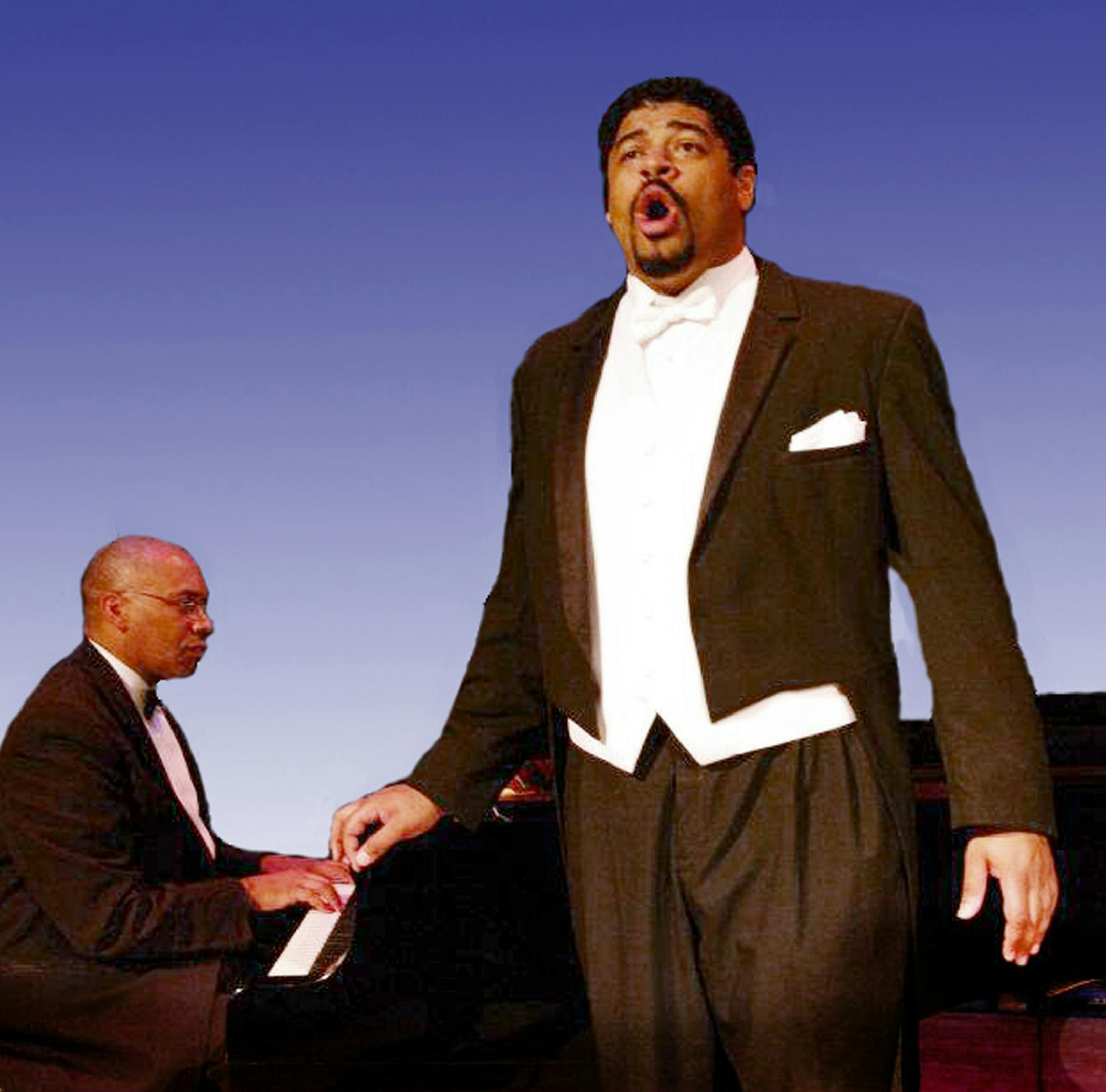 "A Play Based on the Life of Paul Robeson" Jason McKinney (standing) stars as Paul Robeson. Christopher Bagley (sitting at the piano) performs the role of Robeson‚Äôs musical partner, Lawrence Brown. Photo credit: United in Music