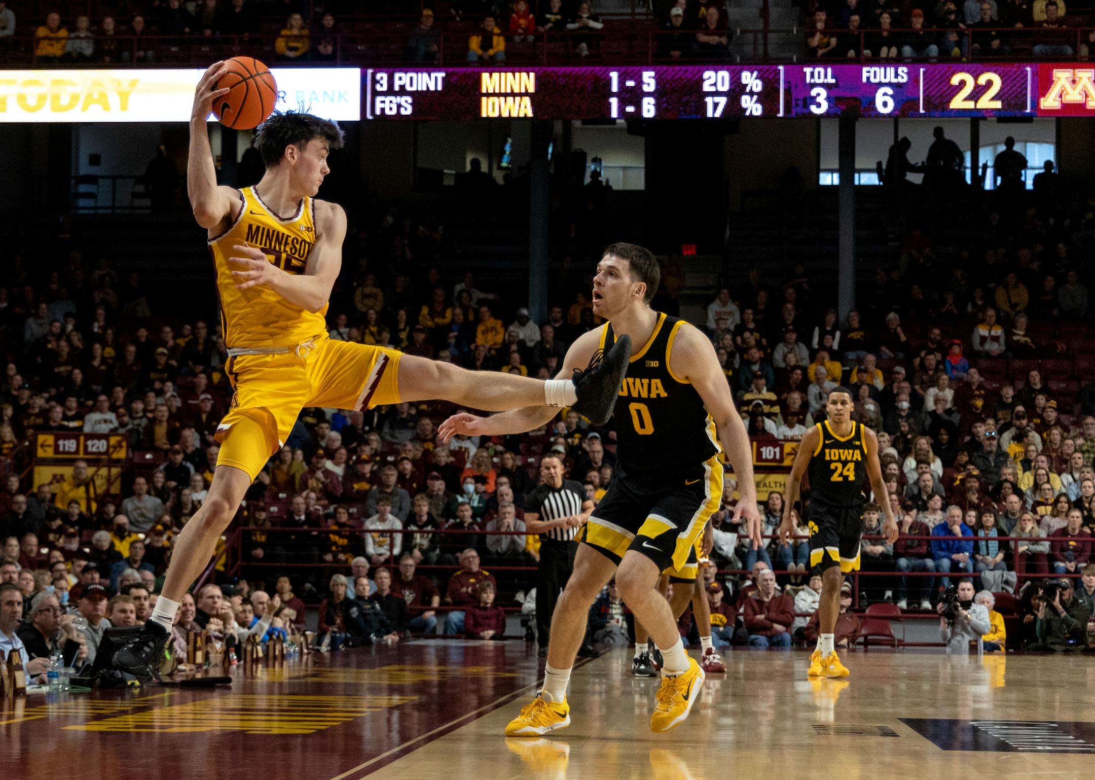 Will Ramberg (25) of the Minnesota Gophers saves ball from going out of bounds in the first half.